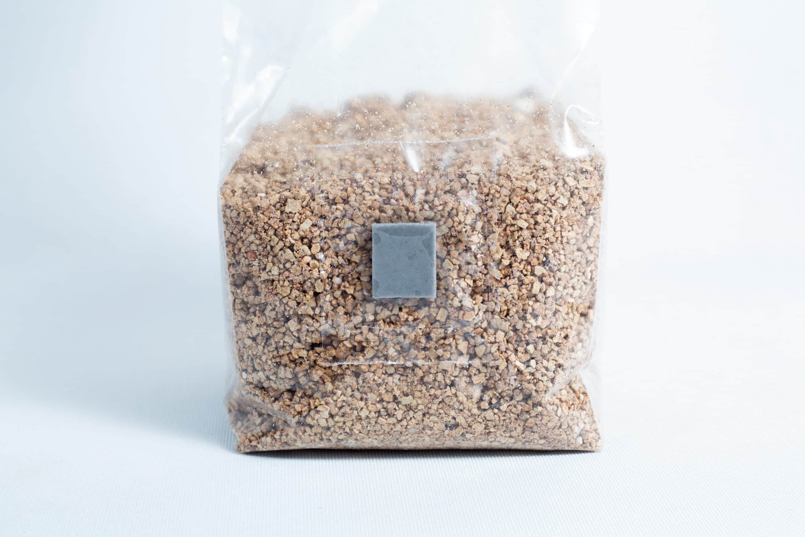 Organic Brown Rice Flour BRF bags 4X 500g PF Tek 3 A clear plastic bag of Organic Brown Rice Flour BRF 4X 500g for PF Tek, sealed and upright on a white surface, filled with small brown granules.
