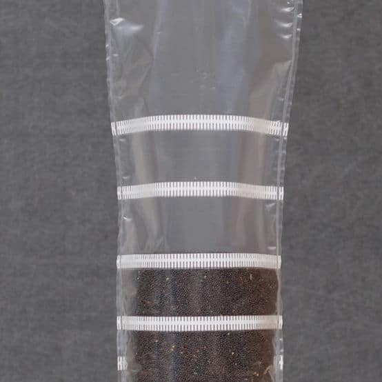 Grow bags Mushroom Sac O2 7 Grow bags Mushroom Sac O2 are clear plastic tubes, partially filled with dark soil and sealed in horizontal sections, ensuring optimal conditions for mushroom cultivation.