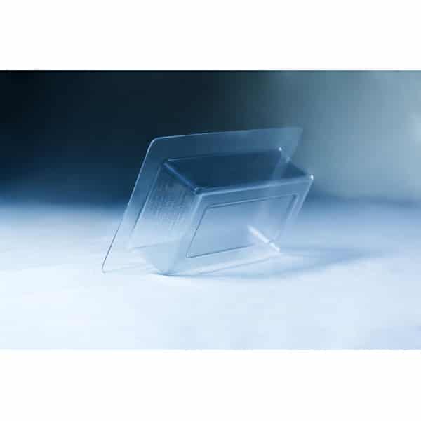 The Mycelium Mould Growth form - Brick (Reusable) is shown as a clear plastic blister tray, tilted on a white and blue gradient surface.