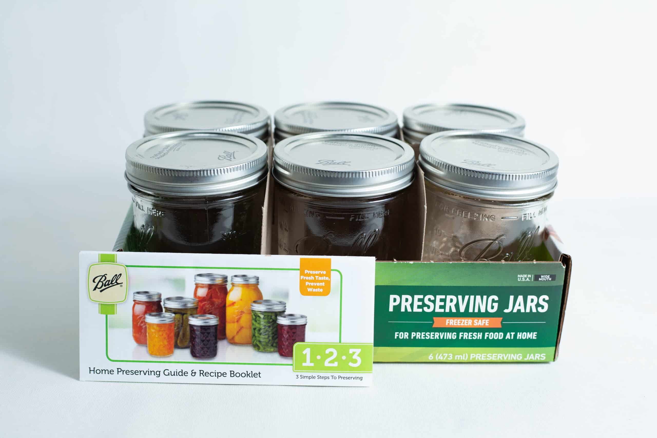 Ball mason pint jars wide mouth set of 6 2 Ball Mason pint jars wide mouth set of 6 includes a box and a booklet with colourful preserved foods pictured in jars on the cover.