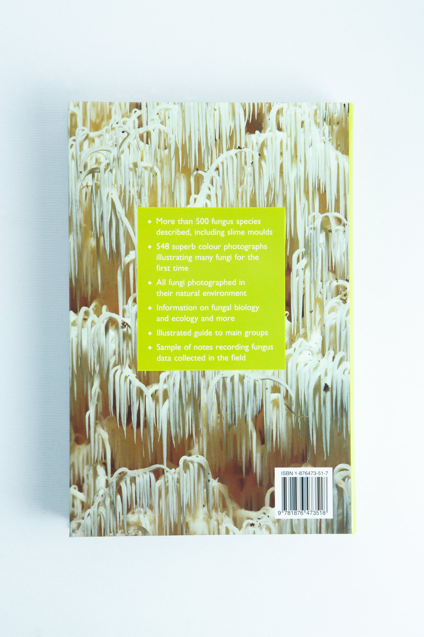 A Field Guide to Australian Fungi Book by Bruce Fuhrer 2 Back cover of "A Field Guide to Australian Fungi Book by Bruce Fuhrer," featuring a photo of white fungi and a green box with yellow text highlighting key features—a must-have for mycology enthusiasts and those seeking an Australian fungi field guide.