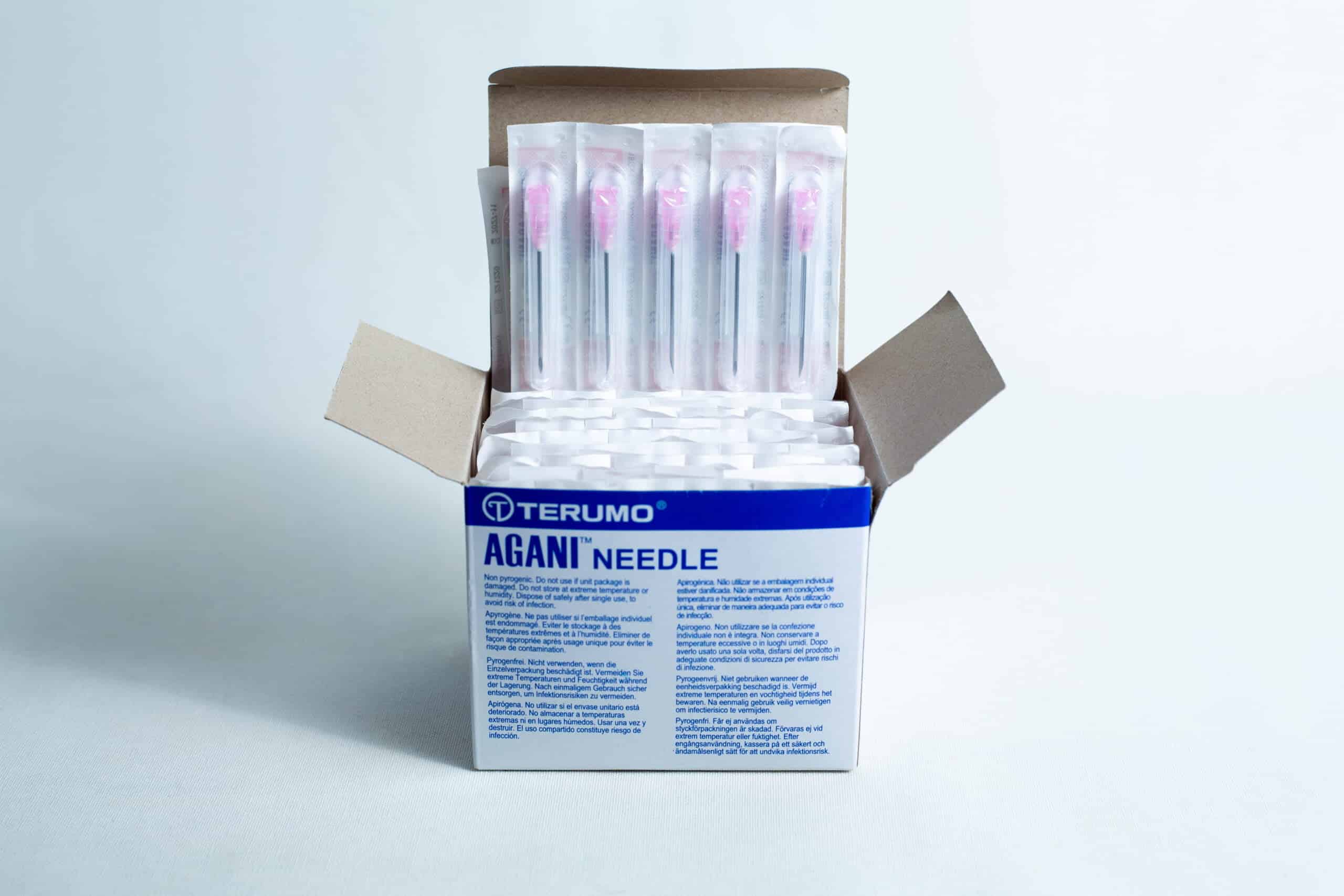 Sterile 18G hypodermic needles whole box 100pcs 7 Open box of sterile 18G hypodermic needles whole box 100pcs, showing several individually wrapped sterile needles inside.