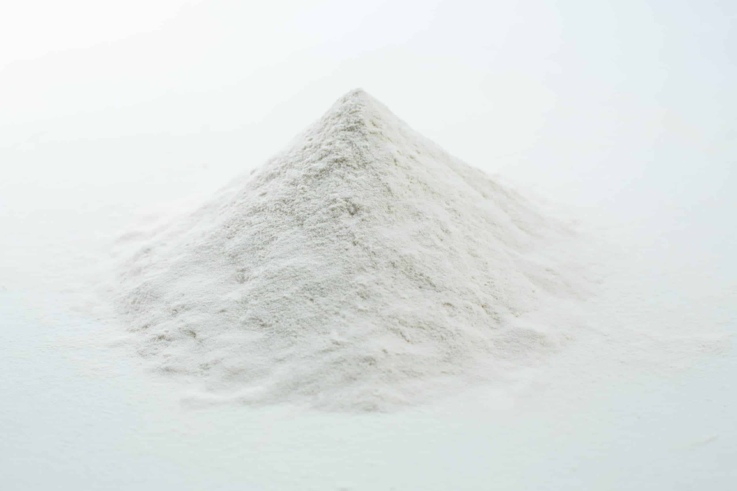 Agar Agar Powder 2 A small mound of fine white powder on a plain white surface, resembling Agar Mix MYAG Antibacterial Malt Extract Yeast used for culturing microbes.