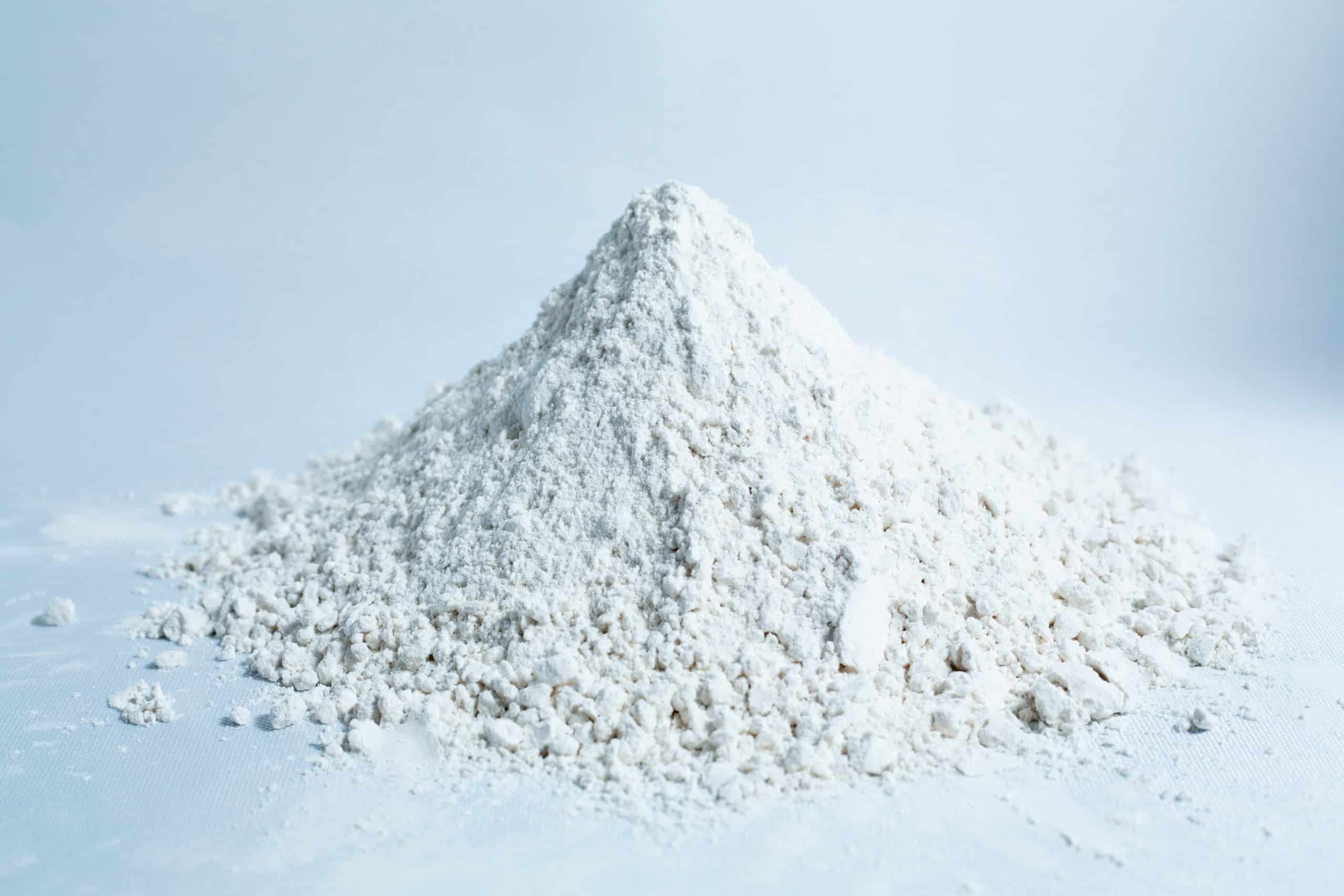 Brown Rice Flour 5kg Organic Food Grade 3 A small mound of Brown Rice Flour 5kg Organic Food Grade on a white surface with a light background.