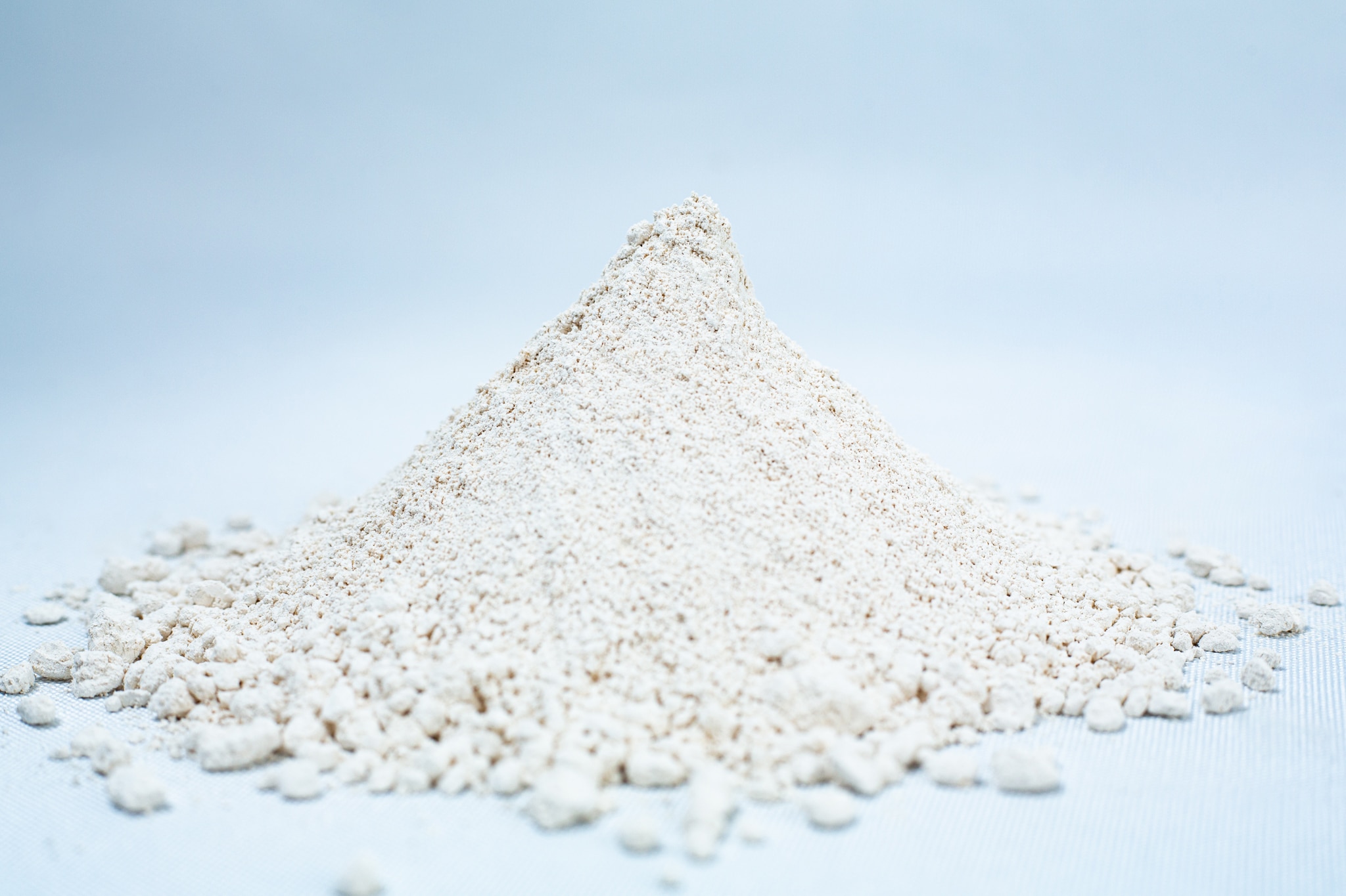 Calcium Hydroxide Hydrated Lime 1 A small mound of fine, off-white Liquid Culture Pre-mix | DLME | Now Extra Clear powder rests on a light surface with a plain background.