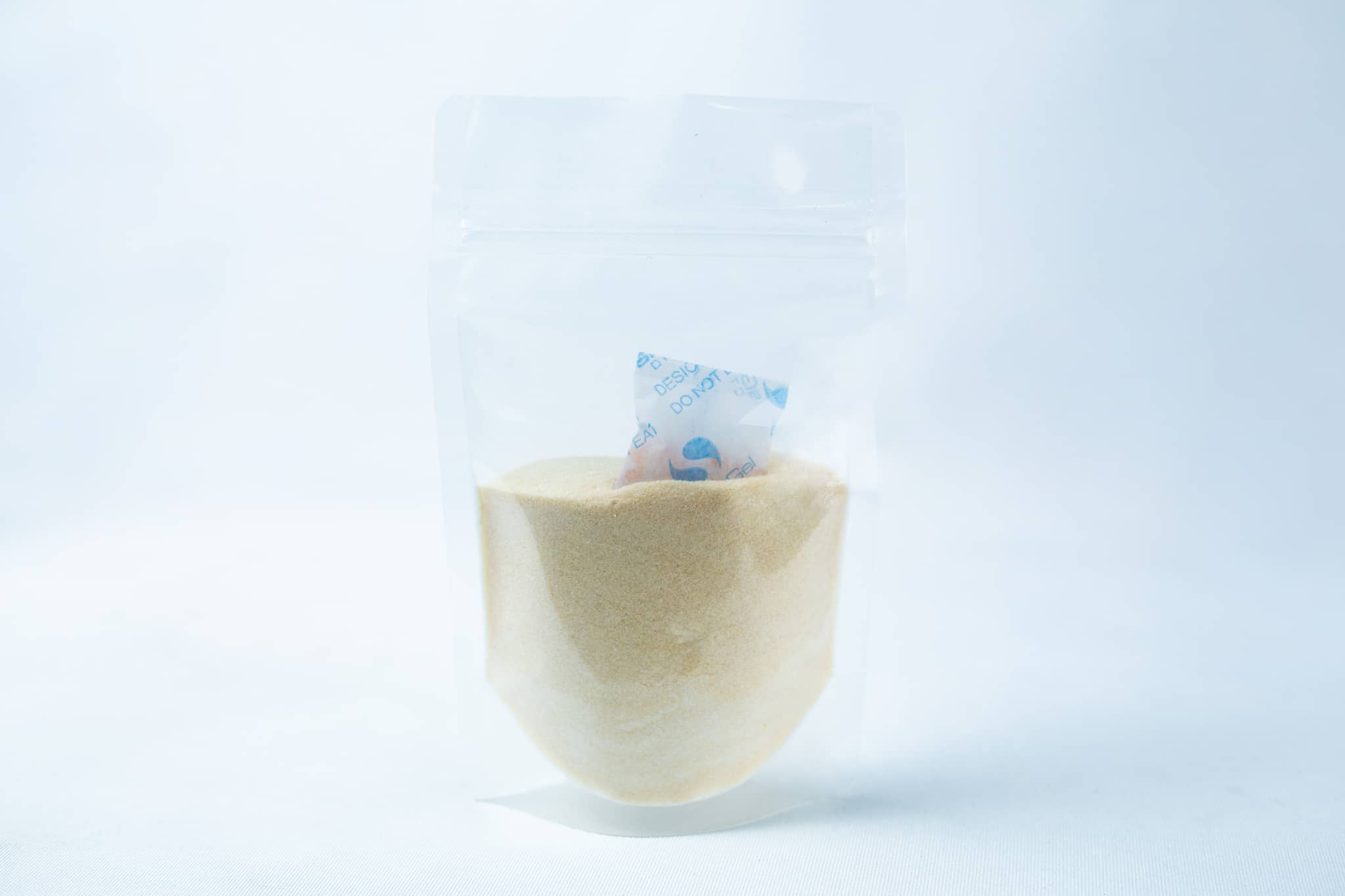 Liquid Culture Kit with Jar, Magnetic Stirrer and LC Mix 3 A transparent pouch of Liquid Culture Pre-mix | DLME | Now Extra Clear, containing light yellow dextrose and light malt extract powder, with a small silica gel sachet inside.