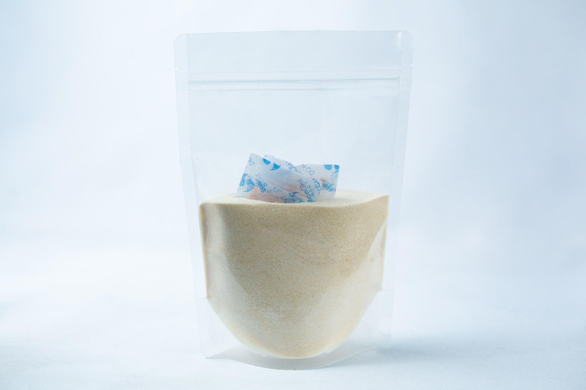 Liquid Culture Pre-mix | Supercharge | Now extra clear 2 Liquid Culture Pre-mix | DLME | Now Extra Clear: Clear plastic pouch containing Dextrose and Light Malt Extract powder blend, with a small silica gel sachet inside, displayed on a white background.