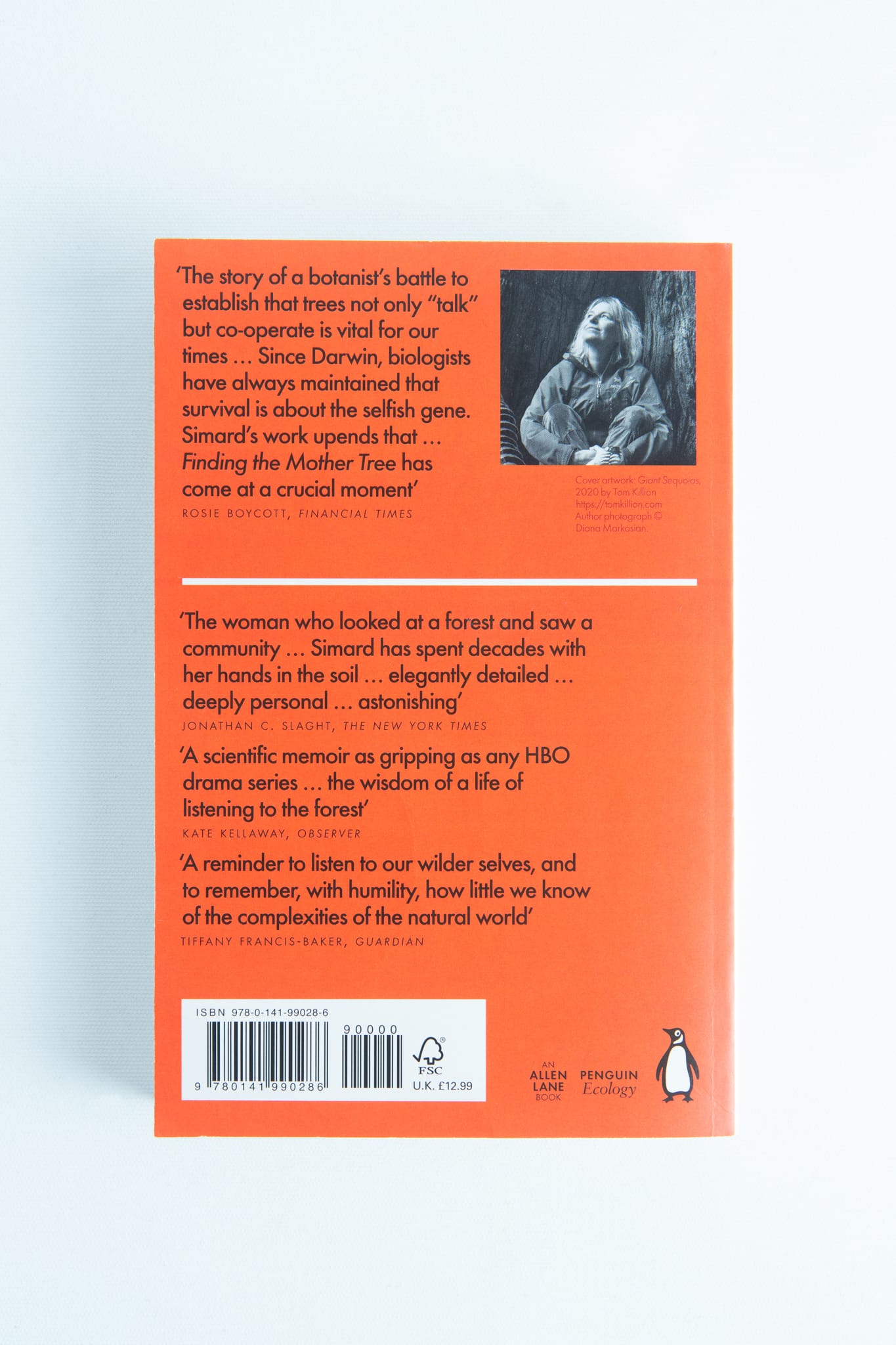 Finding the Mother Tree by Suzanne Simard 2 Back cover of Finding the Mother Tree by Suzanne Simard features reviews, a barcode, and a small black-and-white author photo on an orange background—ideal for fans of mushroom books.