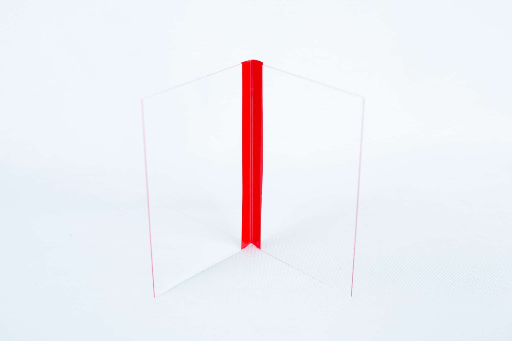 Glass Spore Print Slides booklet 12.8cm X 8.5cm x 1mm 3 The Glass Spore Print Slides booklet (12.8cm x 8.5cm x 1mm) includes two clear acrylic sheets joined at a right angle with a red hinge—ideal for securely displaying and preserving visible spore prints.