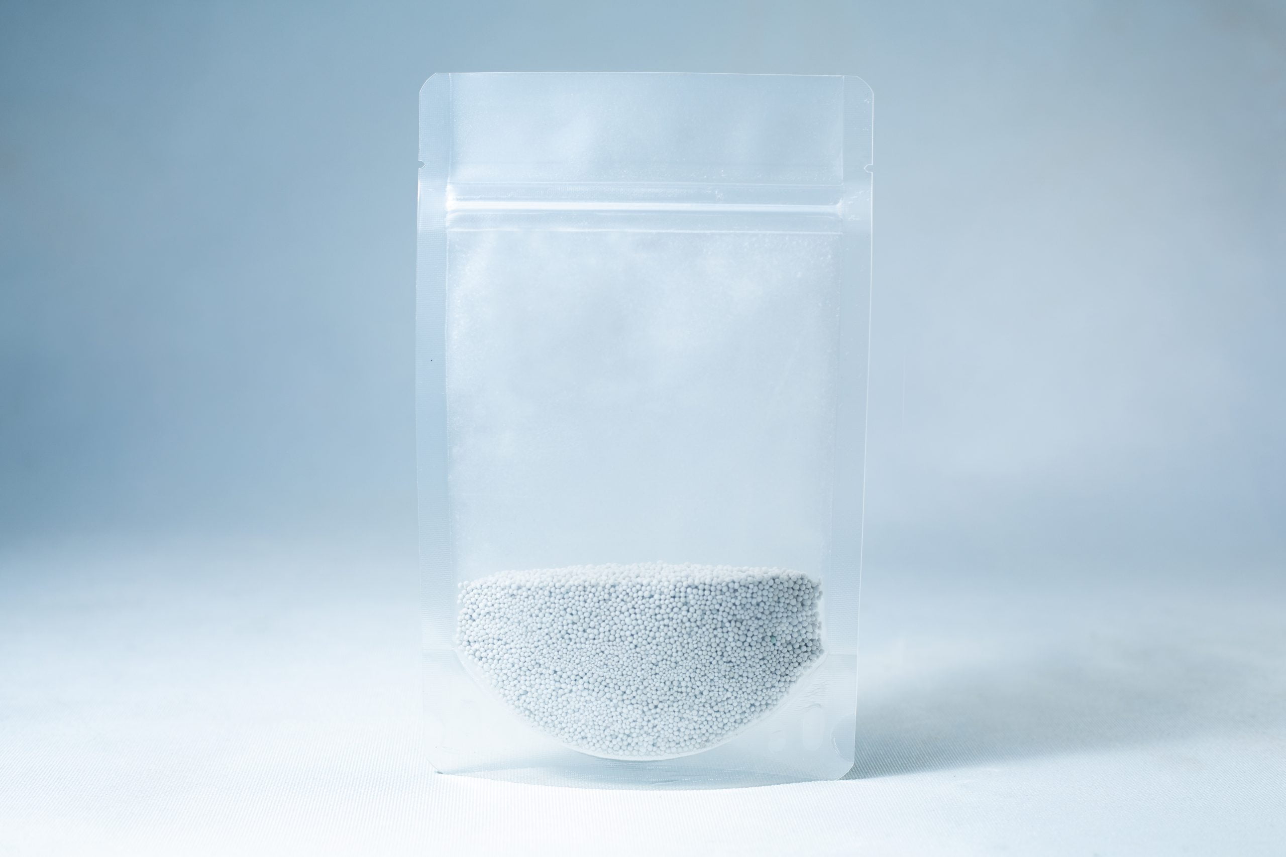 Natural Gypsum coarse grade mushroom supplement grain and substrate 4 A clear resealable bag containing small white Natural Gypsum coarse grade pellets, used as a mushroom supplement for grain and substrate, is shown on a light blue background.