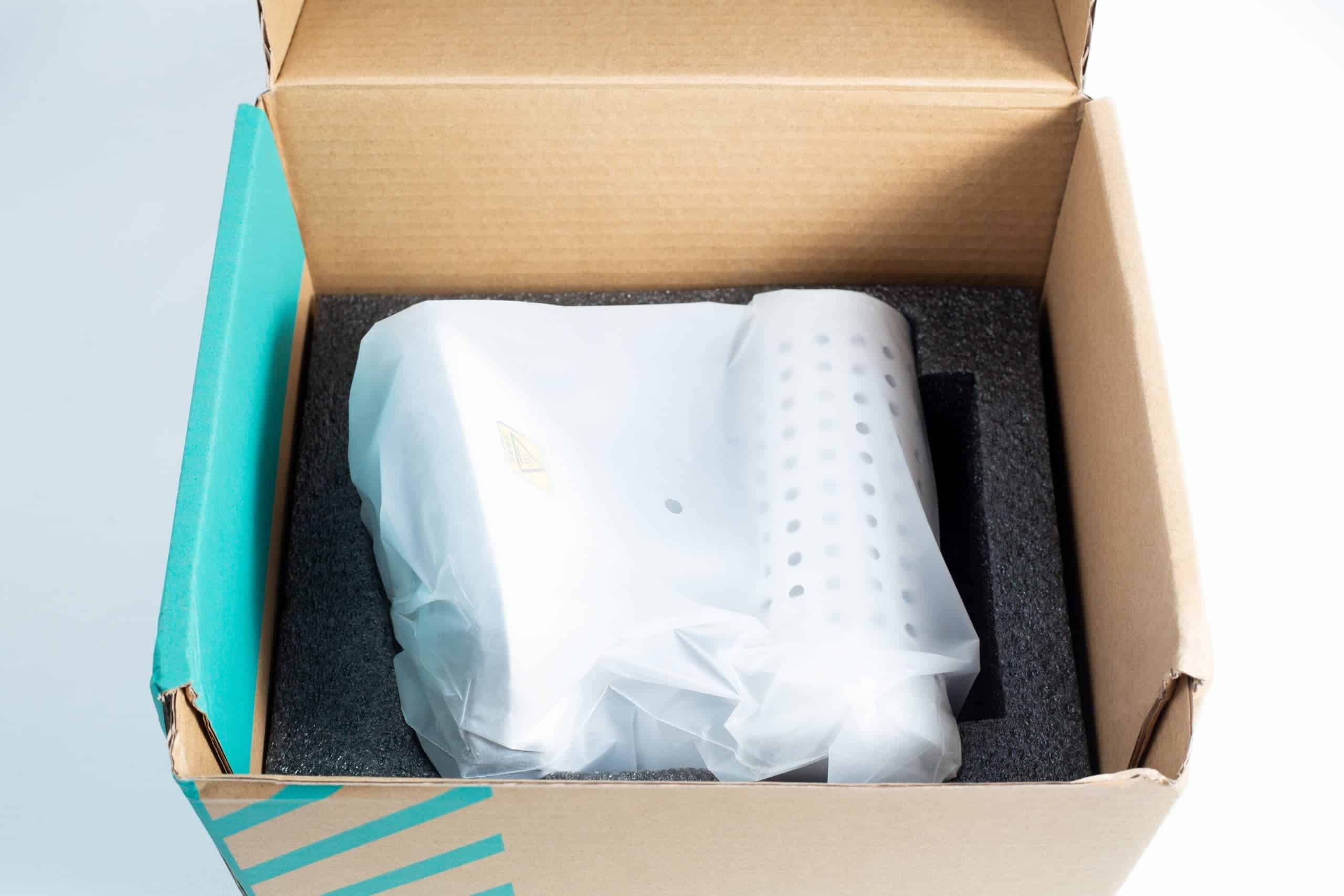 Infrared Sterilizer Bacti Cinerator Lab tool 3 An Infrared Steriliser Bacti Cinerator Lab tool, white and wrapped in plastic, is placed inside a cardboard box with protective foam.