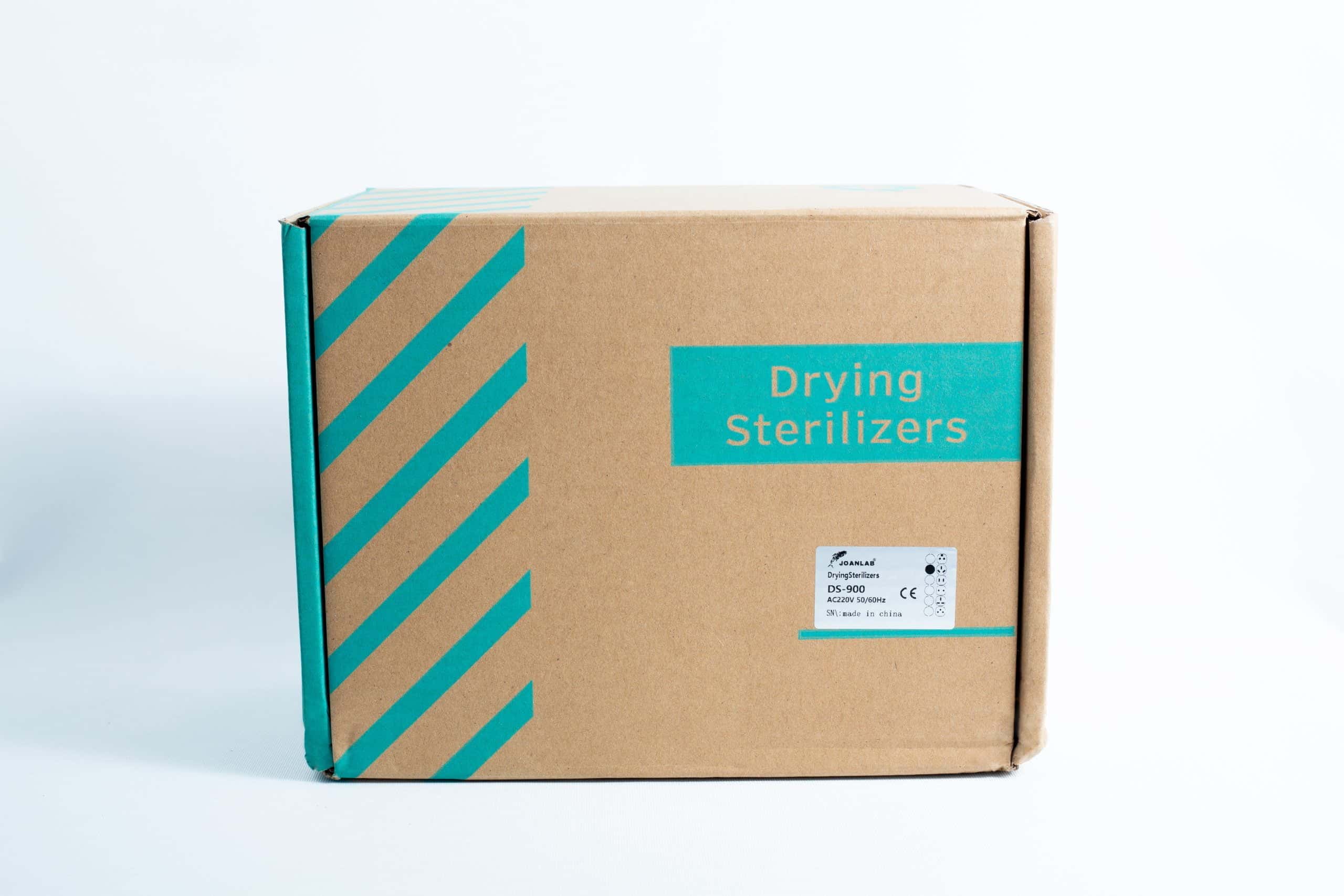 Infrared Sterilizer Bacti Cinerator Lab tool 2 A cardboard box with teal diagonal stripes on white, labelled Infrared Steriliser Bacti Cinerator Lab tool, designed for storing lab steriliser units.