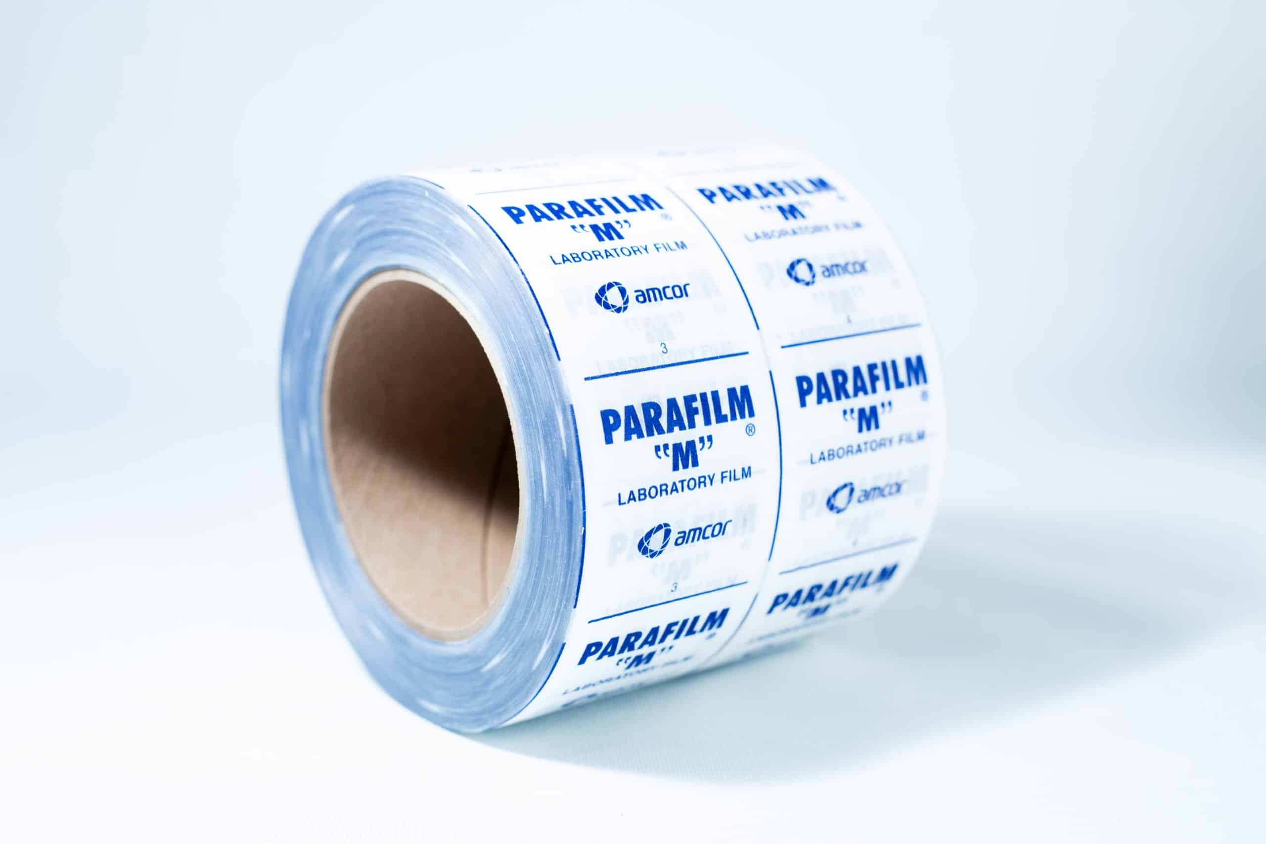 Parafilm Lab sealing film 5 A roll of Parafilm Lab sealing film with blue text on a white background is placed on a white surface.