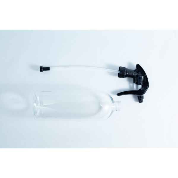 The Spray bottle Chemical resistant 1 Litre Heavy Duty, with a detached black nozzle, rests on a white surface—an ideal choice for safely handling various chemical solutions.