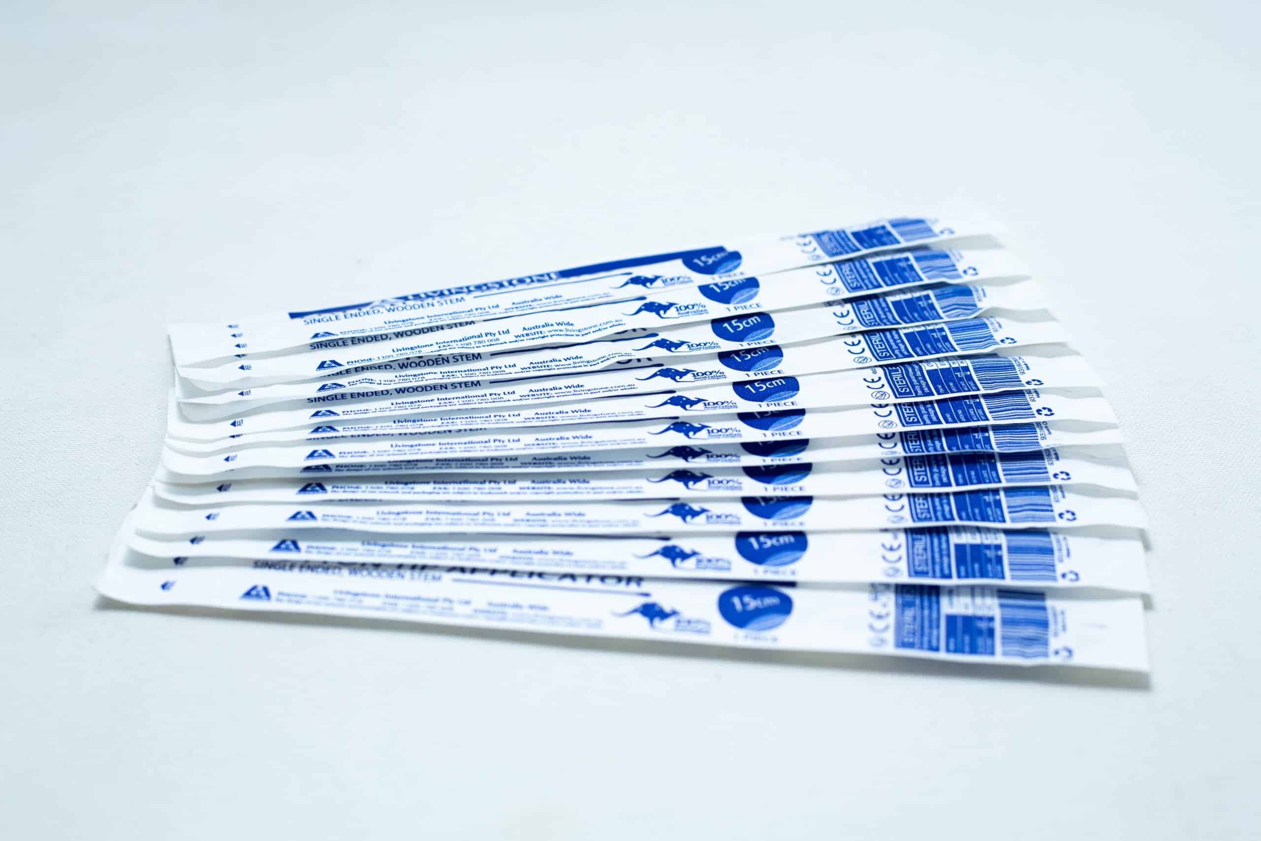 Spore to Agar Transfer Kit 5 Several individually wrapped sterile cotton bud products in white and blue packaging are arranged on a white surface.