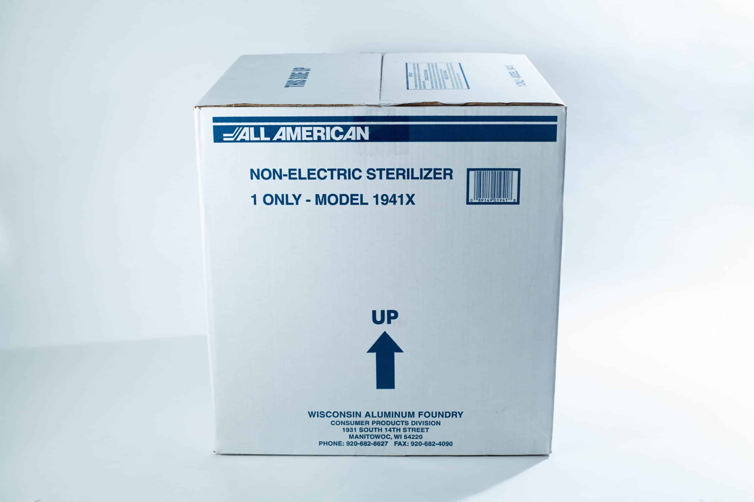1941x All-American Sterilizer (Autoclave) 41 quart/ 39 liters. 8 A large white box labelled Non-Electric Steriliser, Model 1941X with an arrow pointing up.