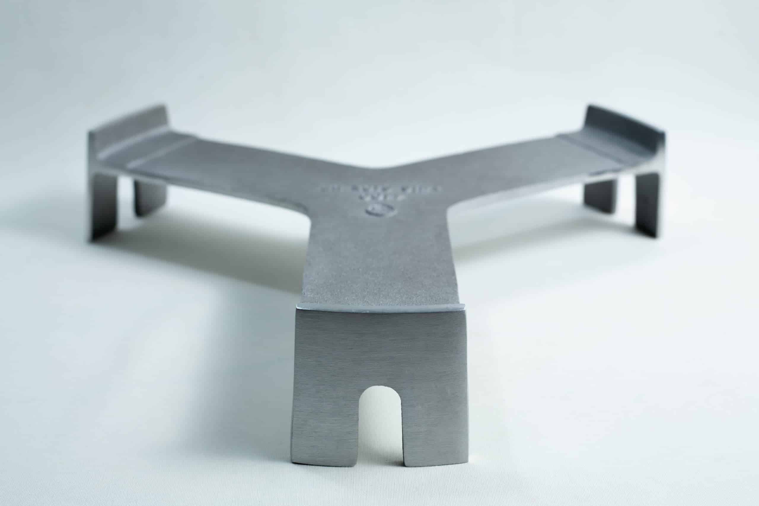 All American 4180 Support Base for 75X Sterilizers 2 Metal trivet with three legs and a flat, Y-shaped design on a plain white background.