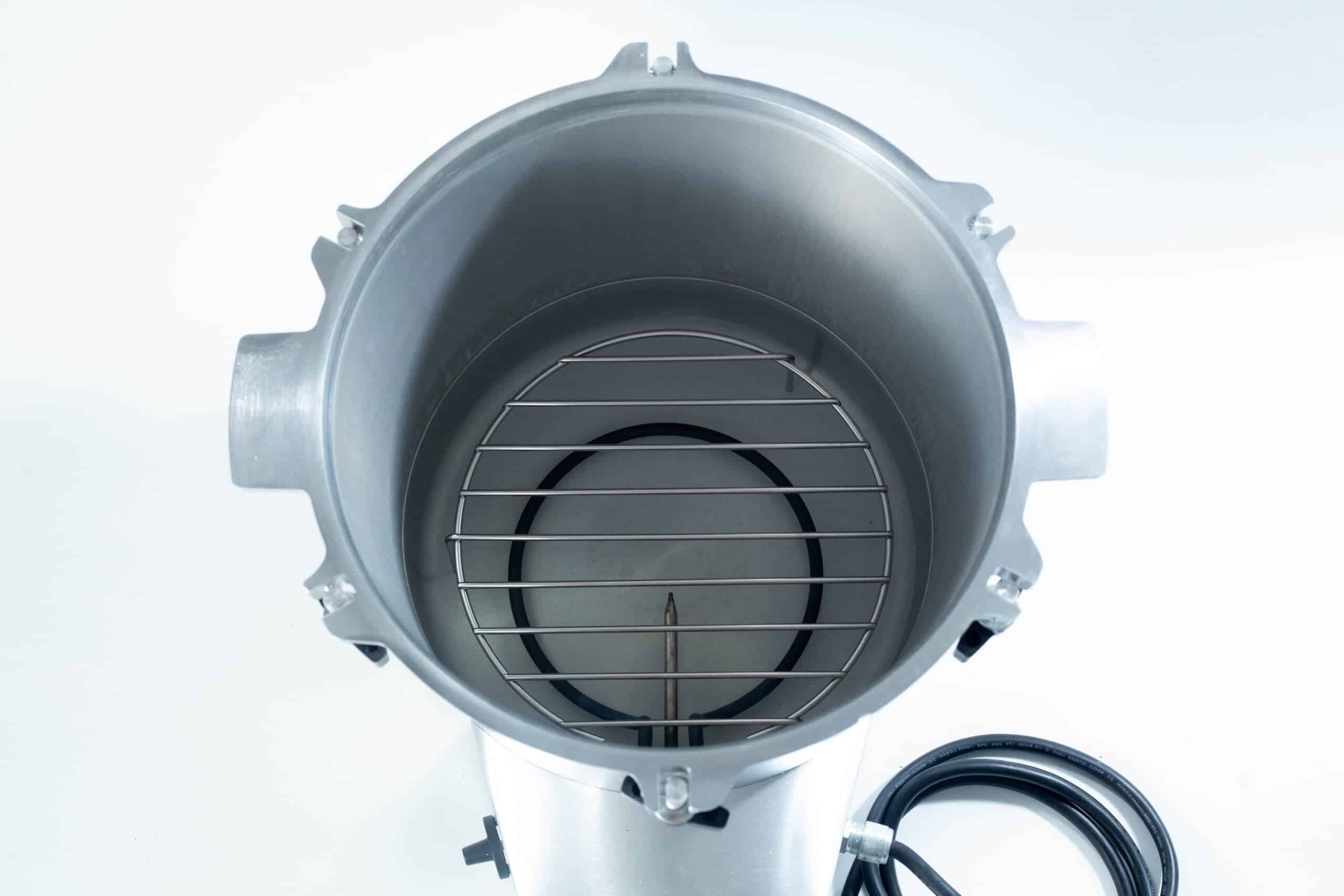 50x All American electric autoclave sterilizer 25 quart 6 Top-down view of an empty metal canister with a wire rack and a black power lead on a white background.