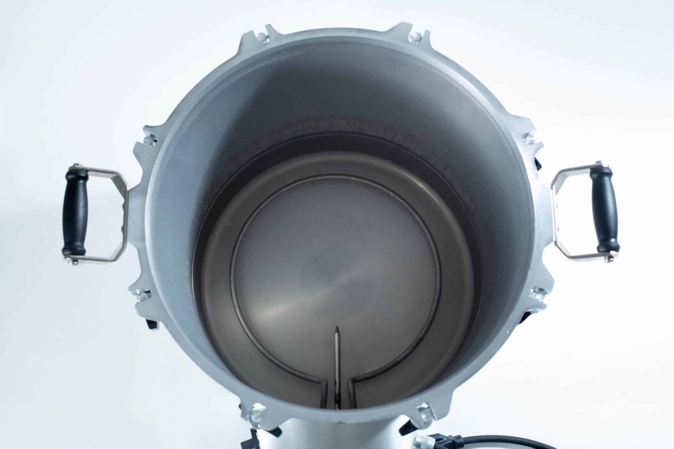 75x All American electric autoclave sterilizer 41 quart 7 Top view of an empty metal brewing kettle with black handles on each side.
