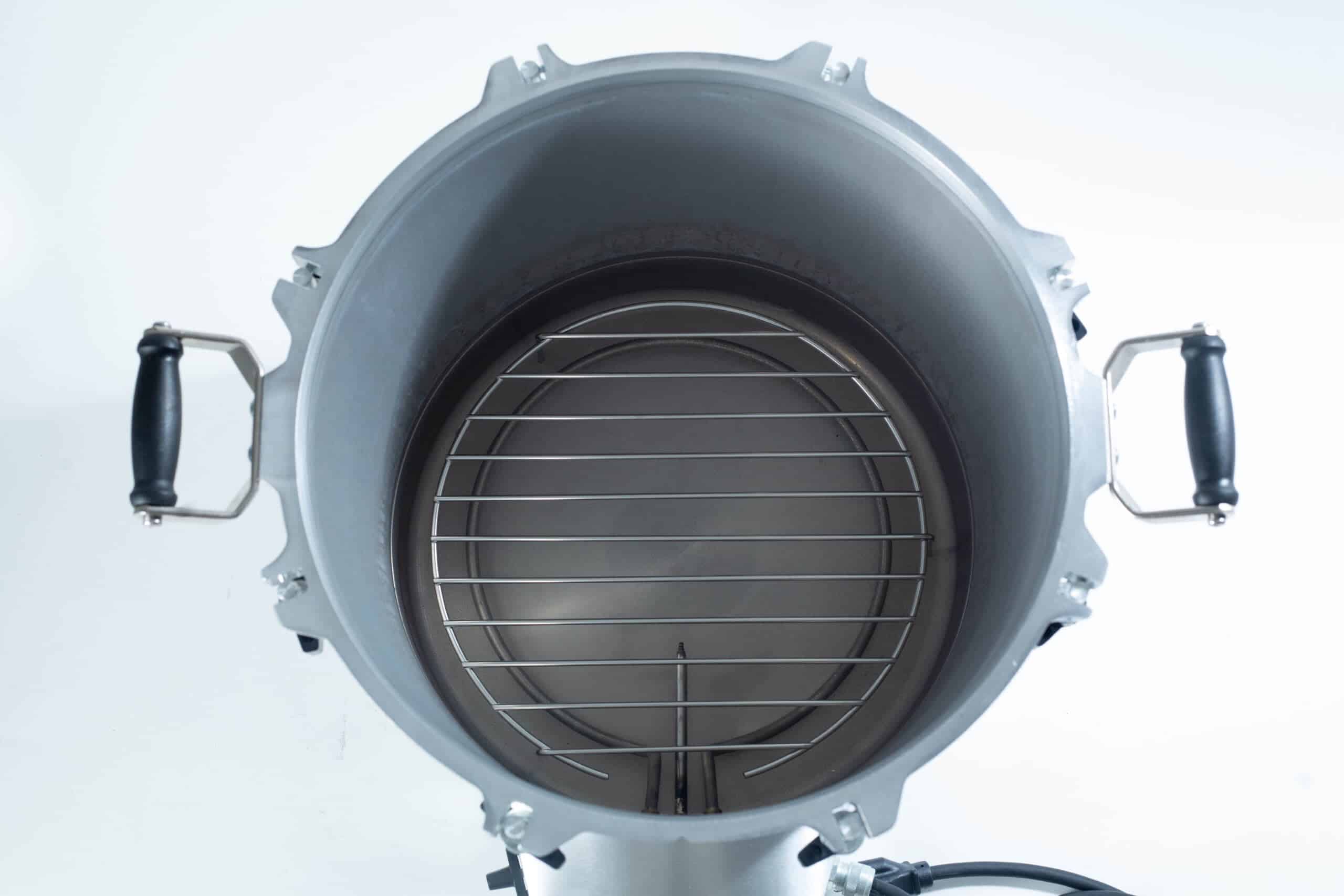 75x All American electric autoclave sterilizer 41 quart 6 Top view of an empty metal pressure cooker with a round rack and side handles.