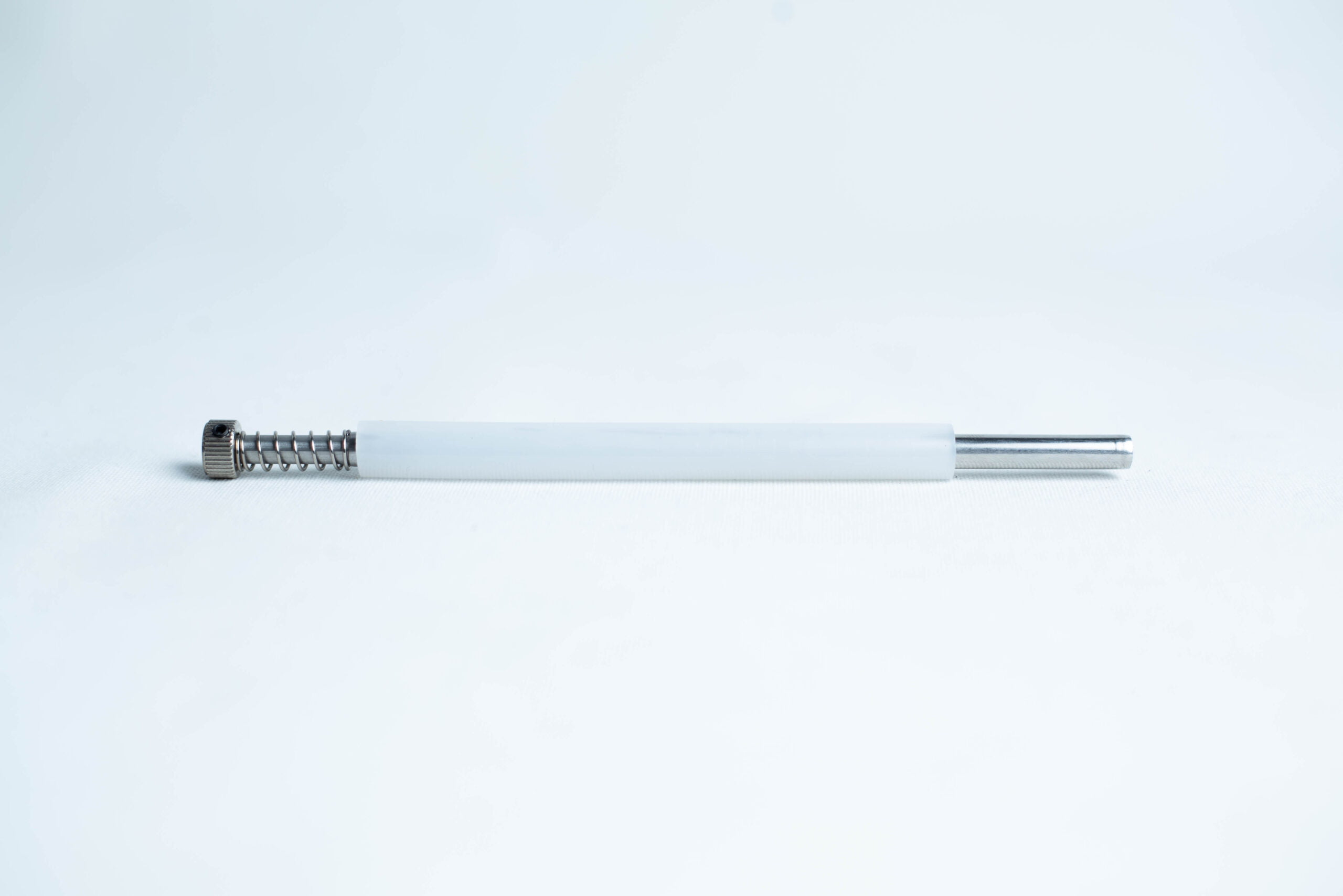 Agar punch transfer tool 1 A single pen ink refill with a white barrel and metal tip on a plain white background.