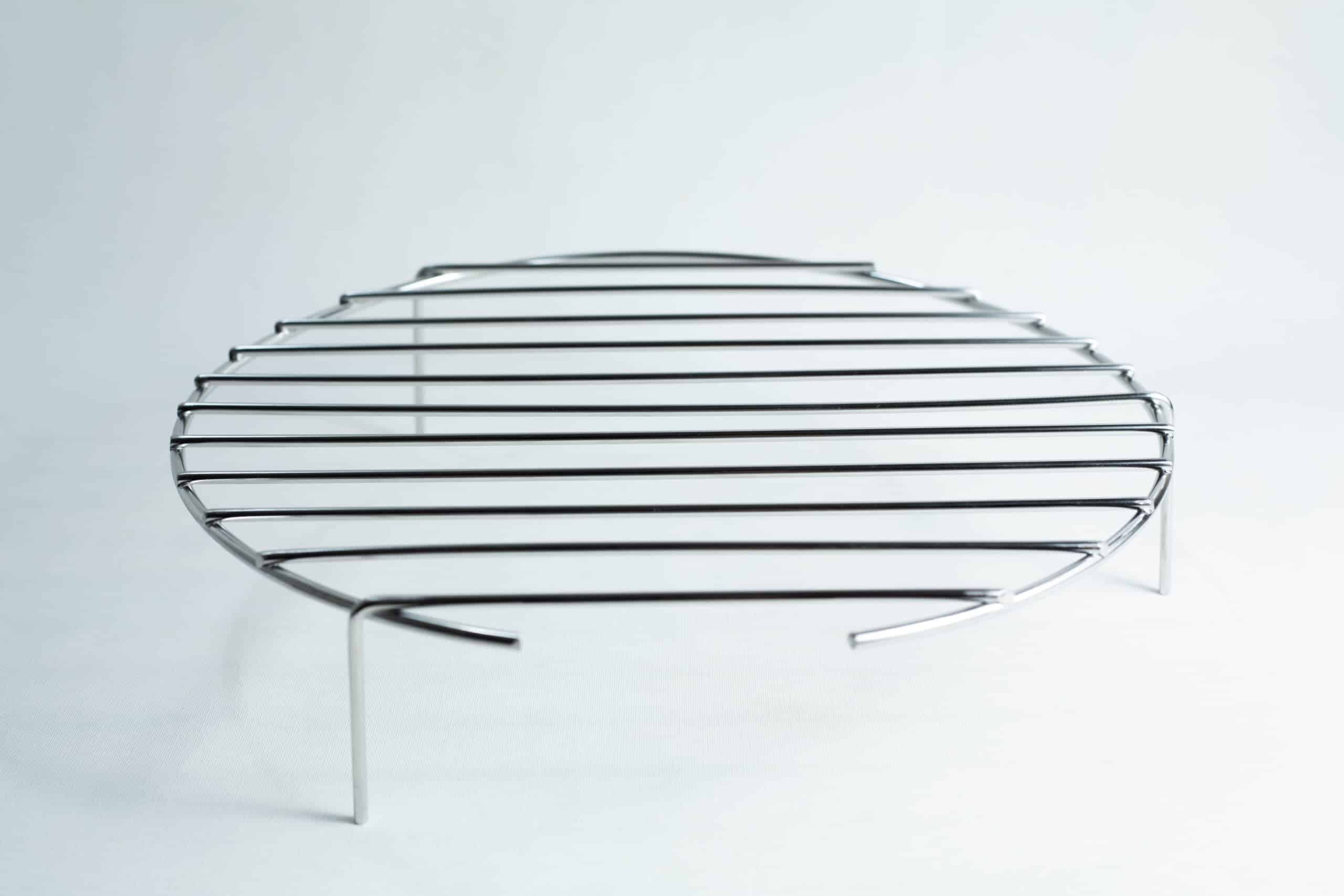 All American 4151 Support Stand for 75X Sterilizers 1 Round metal grill rack with three legs, standing on a white surface, photographed against a plain background.
