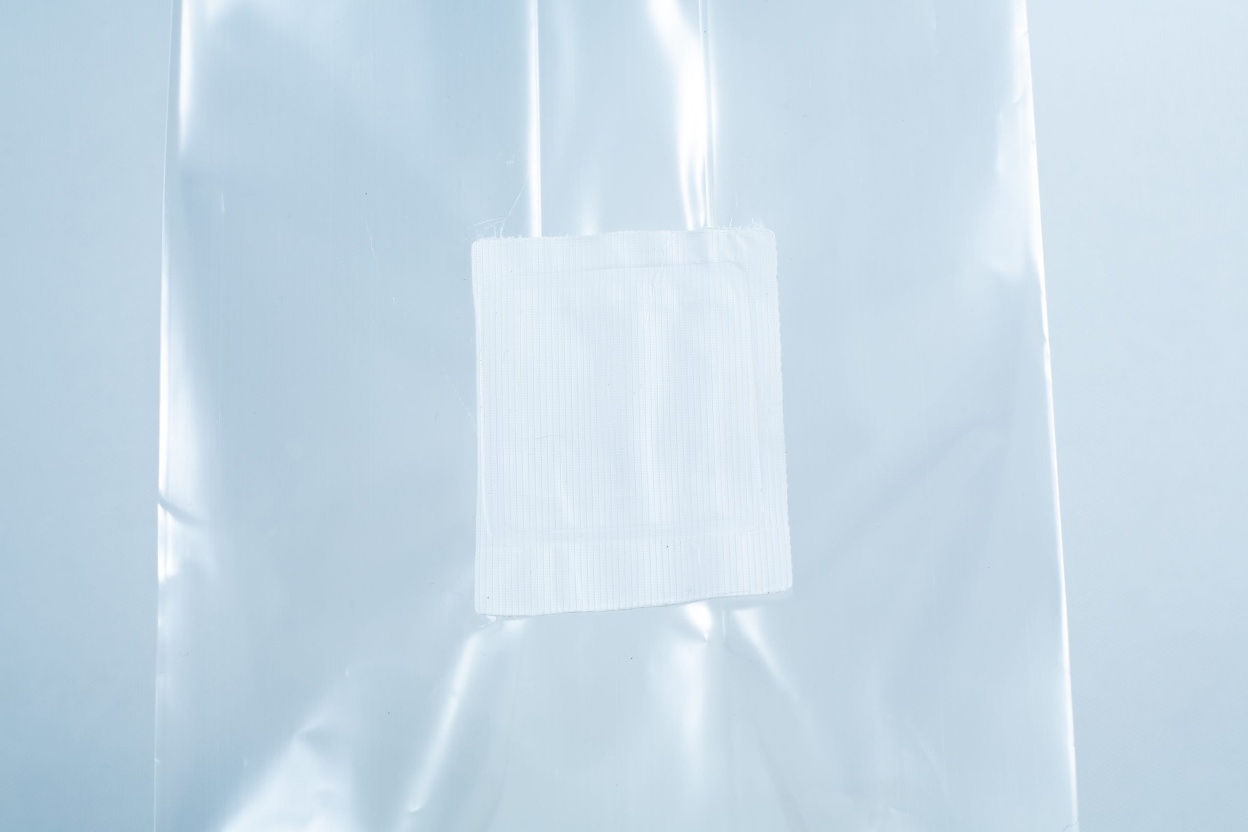 Unicorn Mushroom Grow Bags for spawn and substrate 2 A small white adhesive plaster on a clear plastic surface, perfect for use with Millet pre-sterilised mushroom grains w/injection port and digital instructions.