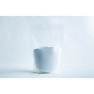 A clear resealable pouch filled with white powder, set against a plain white background.