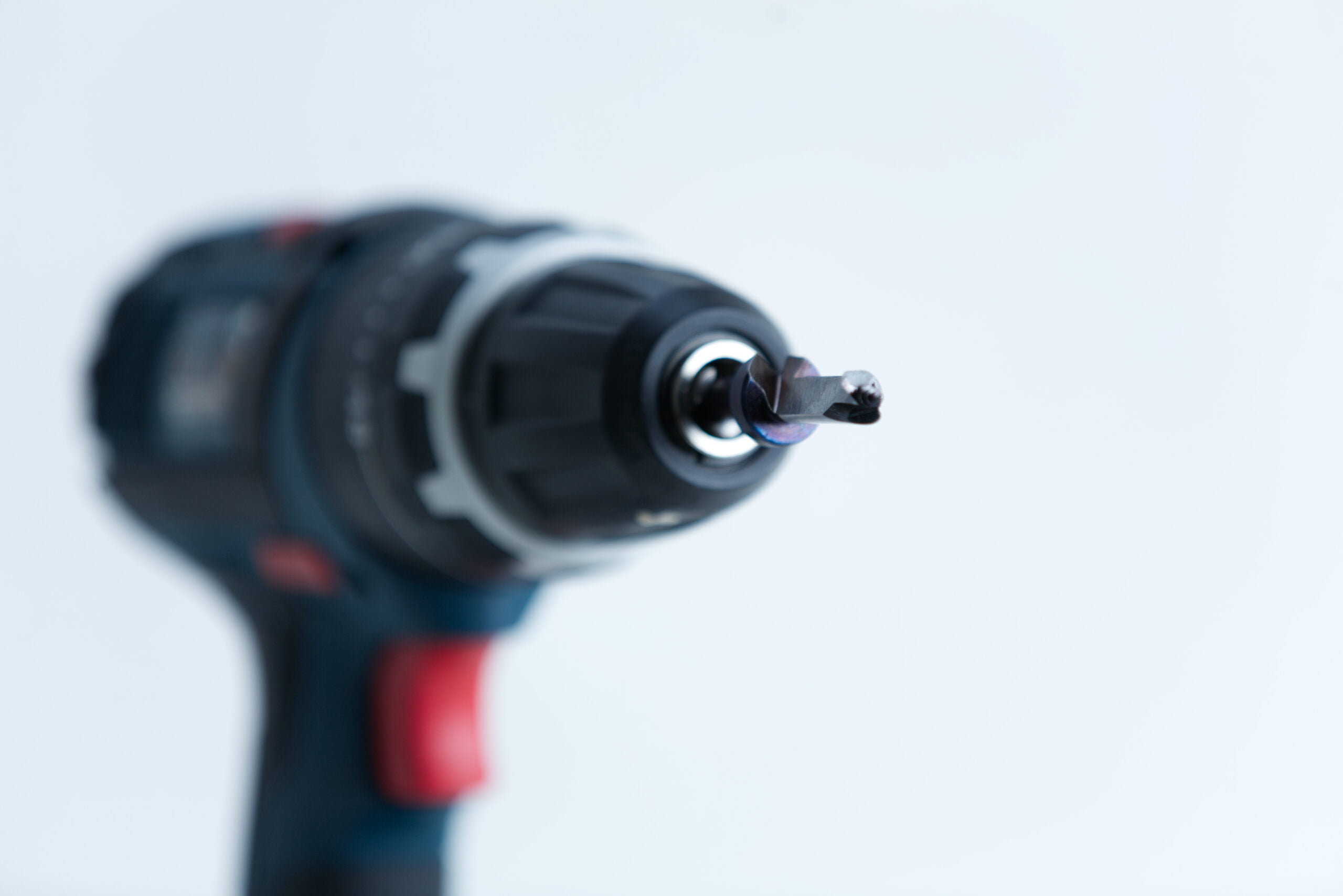 Mushroom Log Kit | Mushroom Inoculation Kit (Log Dowel) 2 Close-up of a cordless power drill with a screwdriver bit, focussed on the bit against a white background.