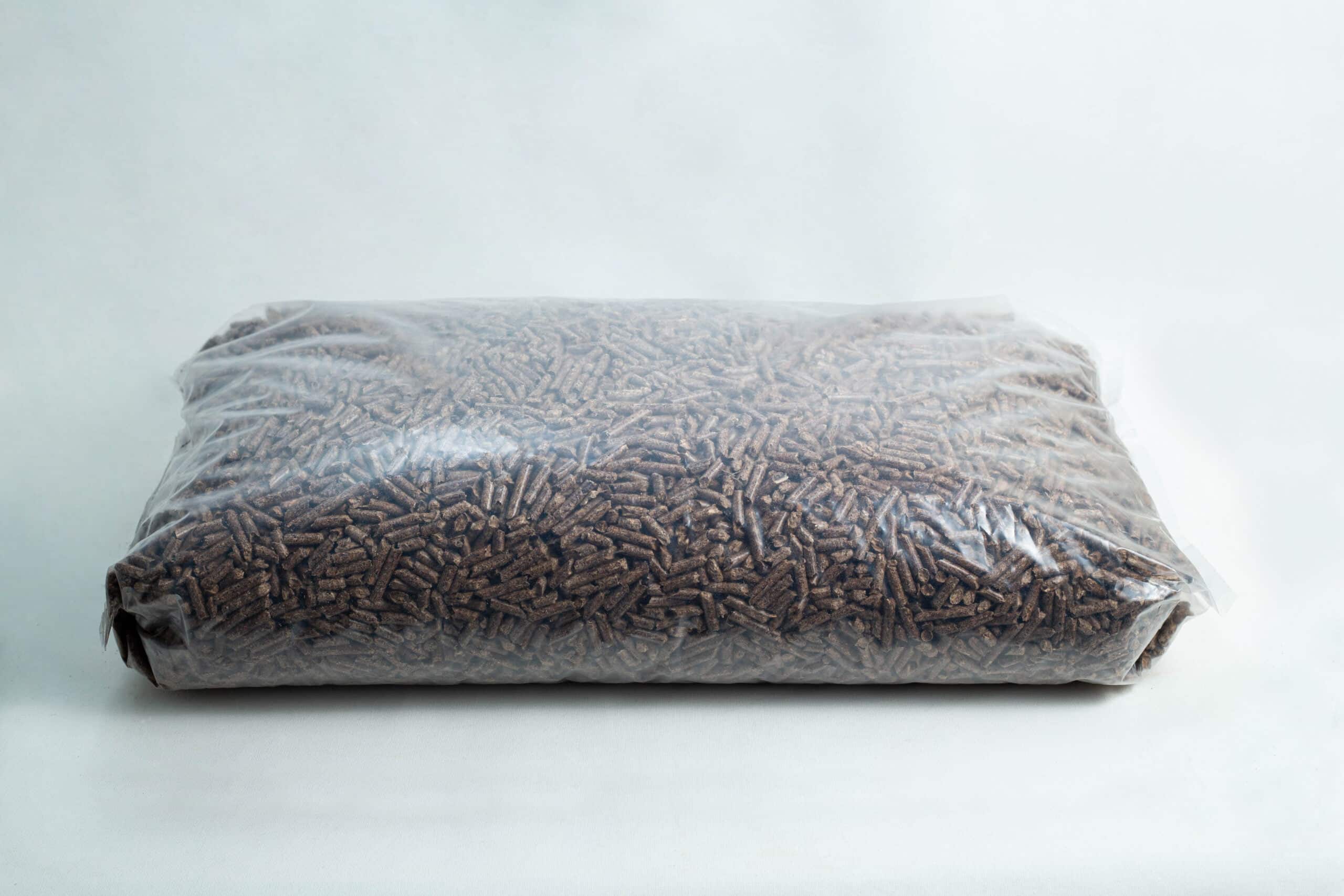 Hardwood Pellets for Mushrooms | Hardwood Fuel Pellets for Mushrooms 1 A sealed plastic bag filled with brown wood pellets on a plain white background.
