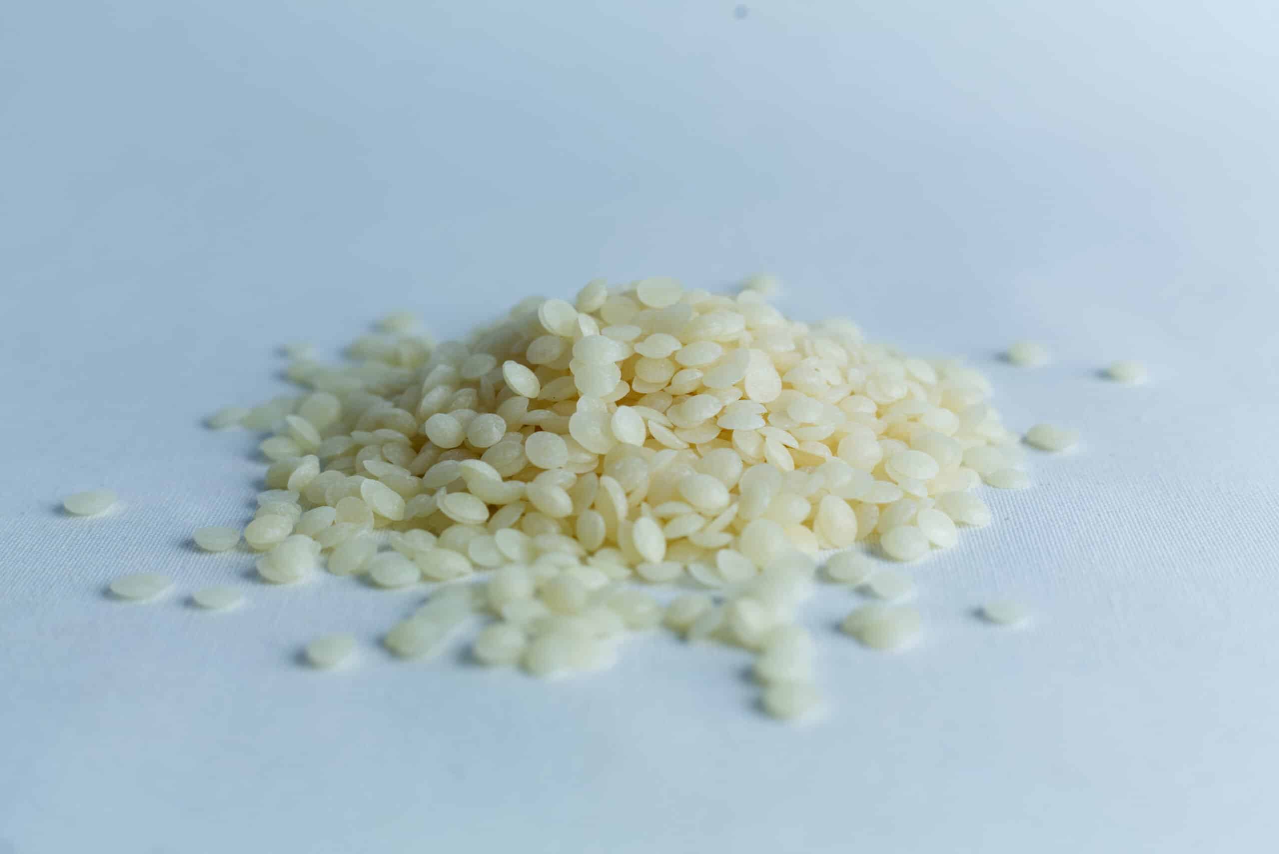 Mushroom Log Kit | Mushroom Inoculation Kit (Log Dowel) 4 A small pile of uncooked white rice grains on a plain, light surface.