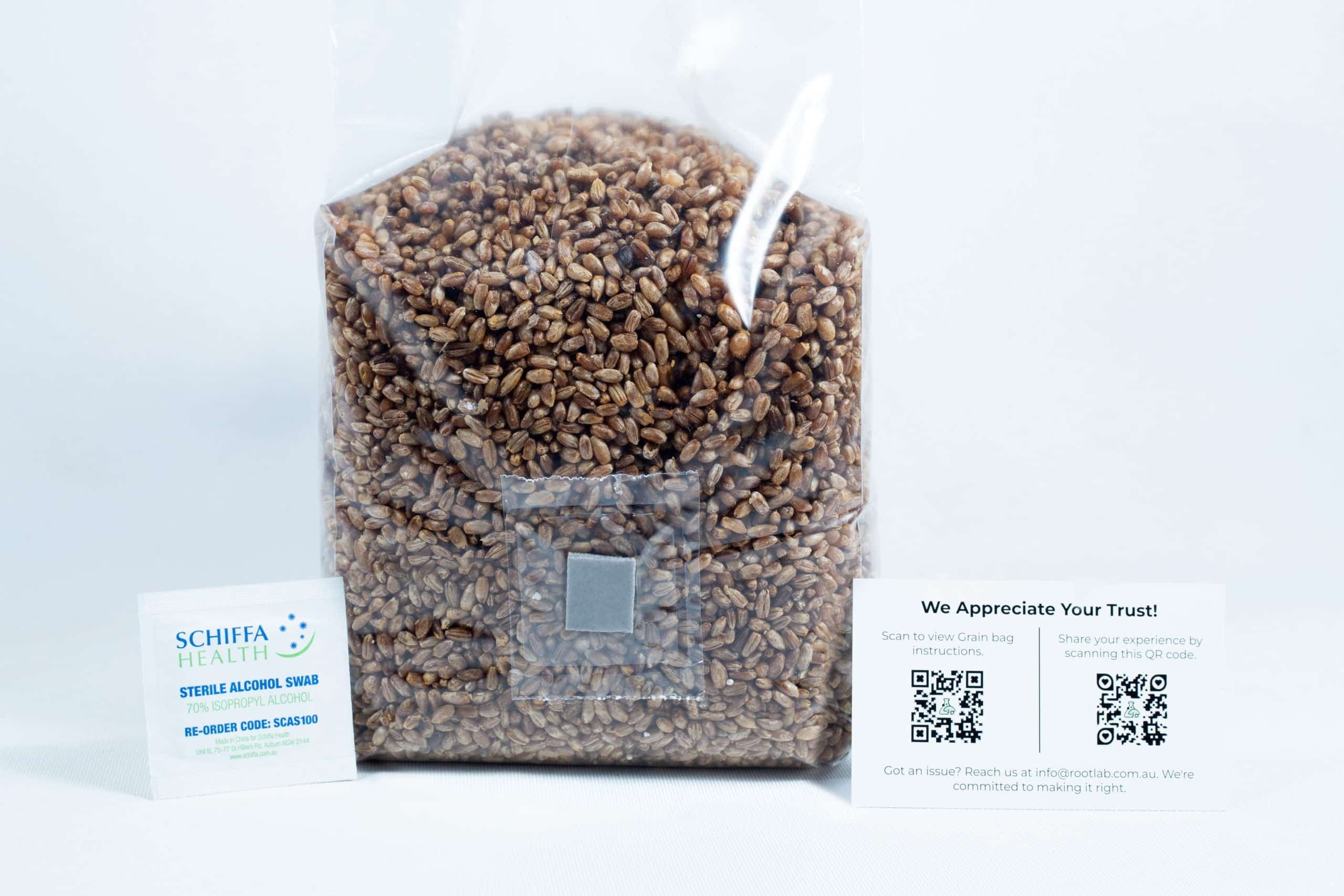 Rye grain organic Pre sterilized for mushroom cultivation w/inj port and air-filter 7 A bag of rye grain organic pre-sterilised for mushroom cultivation with injection port and air filter is placed between a business card and an appreciation card with QR codes, all on a white background.