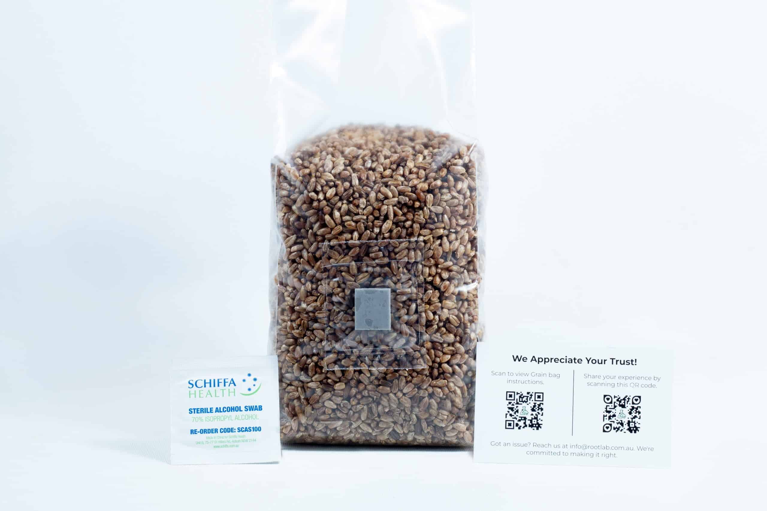 Rye grain organic Pre sterilized for mushroom cultivation w/inj port and air-filter 1 A clear bag of rye grain organic pre-sterilised for mushroom cultivation with injection port and air-filter is shown with two business cards in front on a white background.