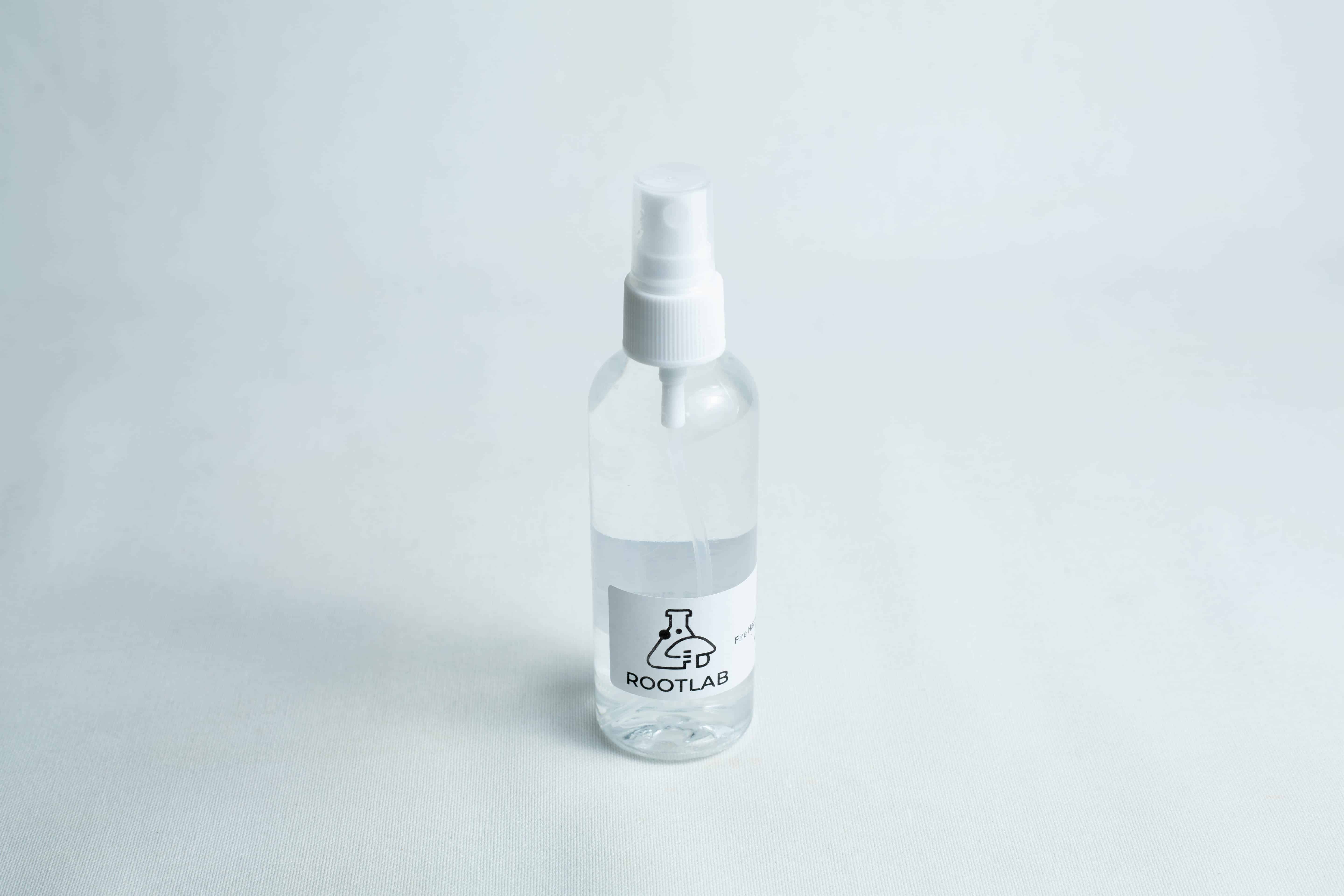 Monotub mushroom growing kit- Max Yield Bins 13 Clear plastic spray bottle labelled ROOTLAB filled with liquid, ideal for use with your Monotub Mushroom Growing Kit-Premium, shown on a white surface.
