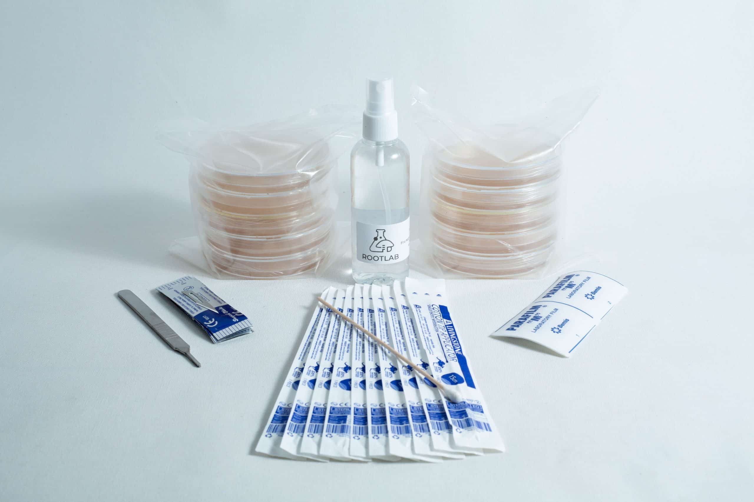 Spore to Agar Transfer Kit 1 The Spore to Agar Transfer Kit includes sterile petri dishes, scalpel, swabs, spray bottle, and alcohol wipes, all displayed on a white background.
