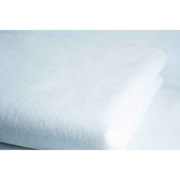 A close-up of a neatly folded white towel and the Light Log Blanket displayed on a white surface.