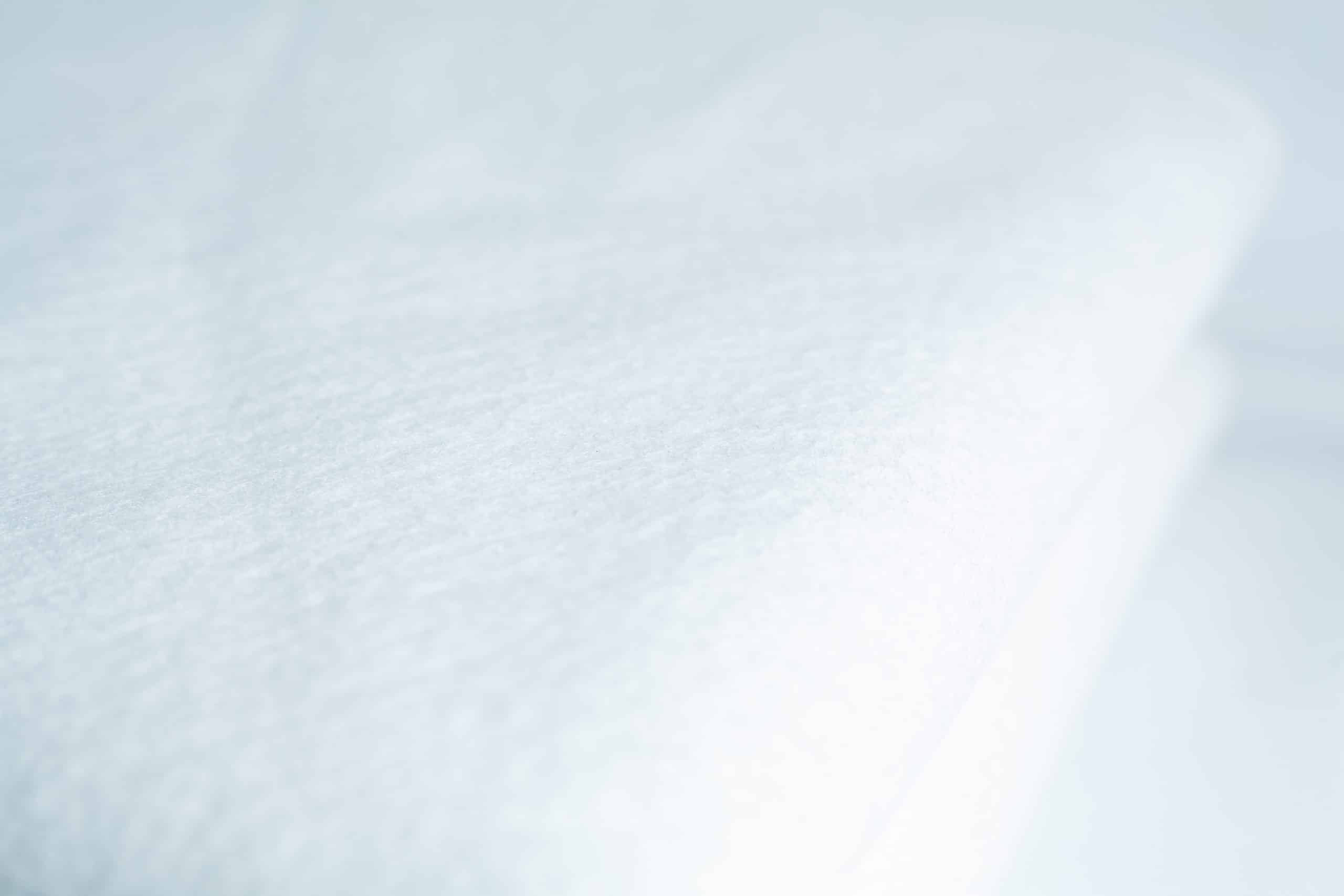 Light Log Blanket 2 Close-up of the Light Log Blanket, showcasing its soft, textured white fabric.
