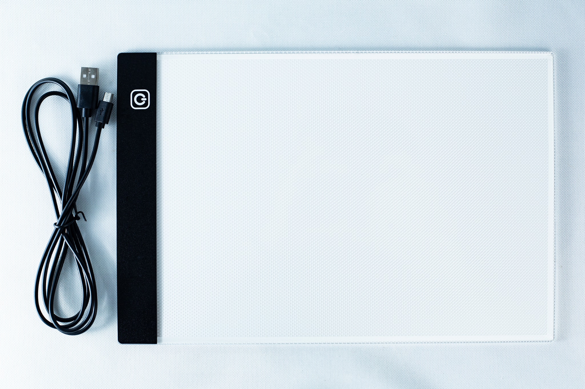 LED light Pad for agar 1 A USB cable and a flat, rectangular LED light pad for tracing on a white background.