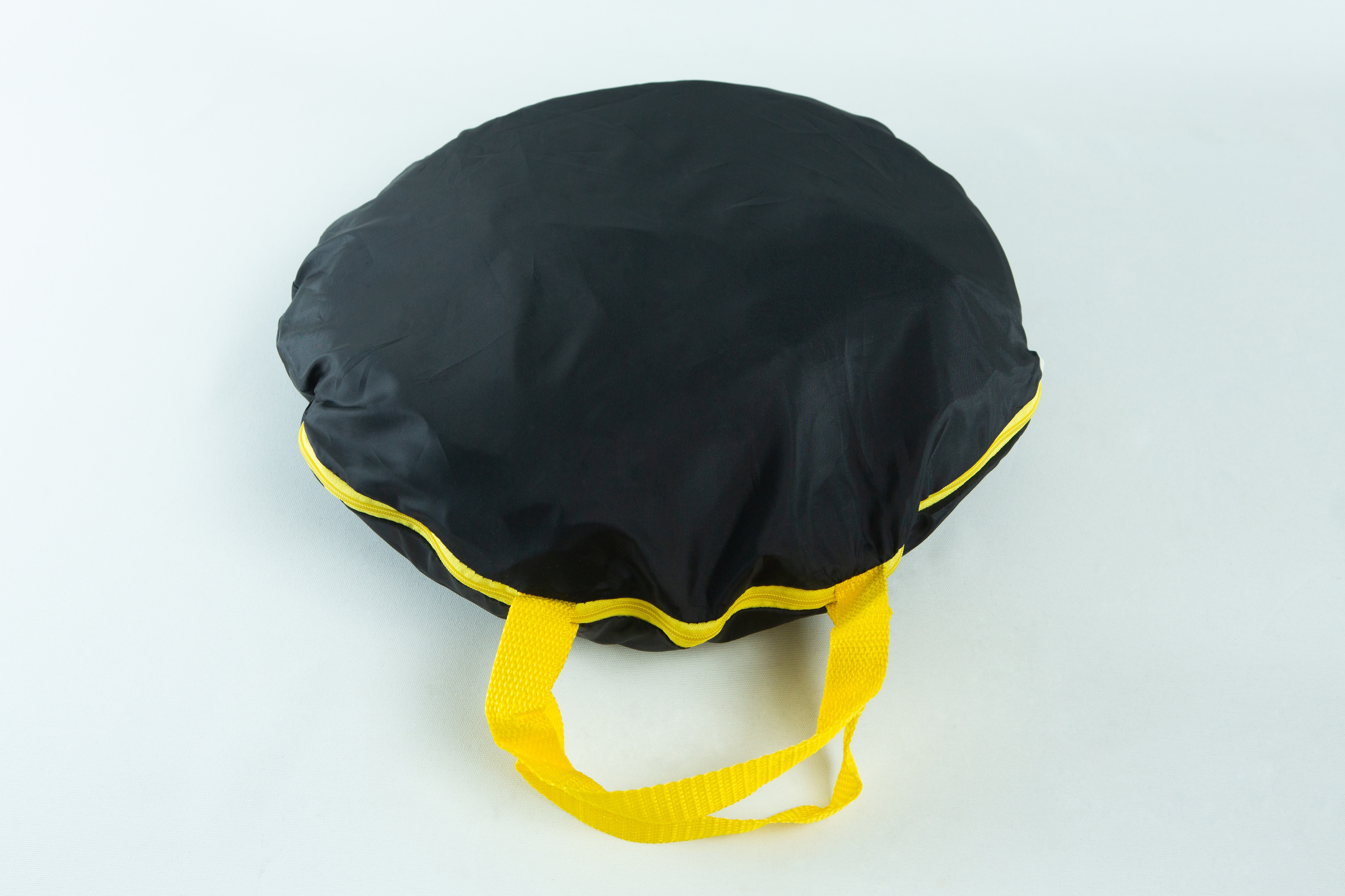 Still Air Box (SAB)| Mushroom | Large | Pop up 2 A black circular bag with yellow handles and trim, placed on a white background.