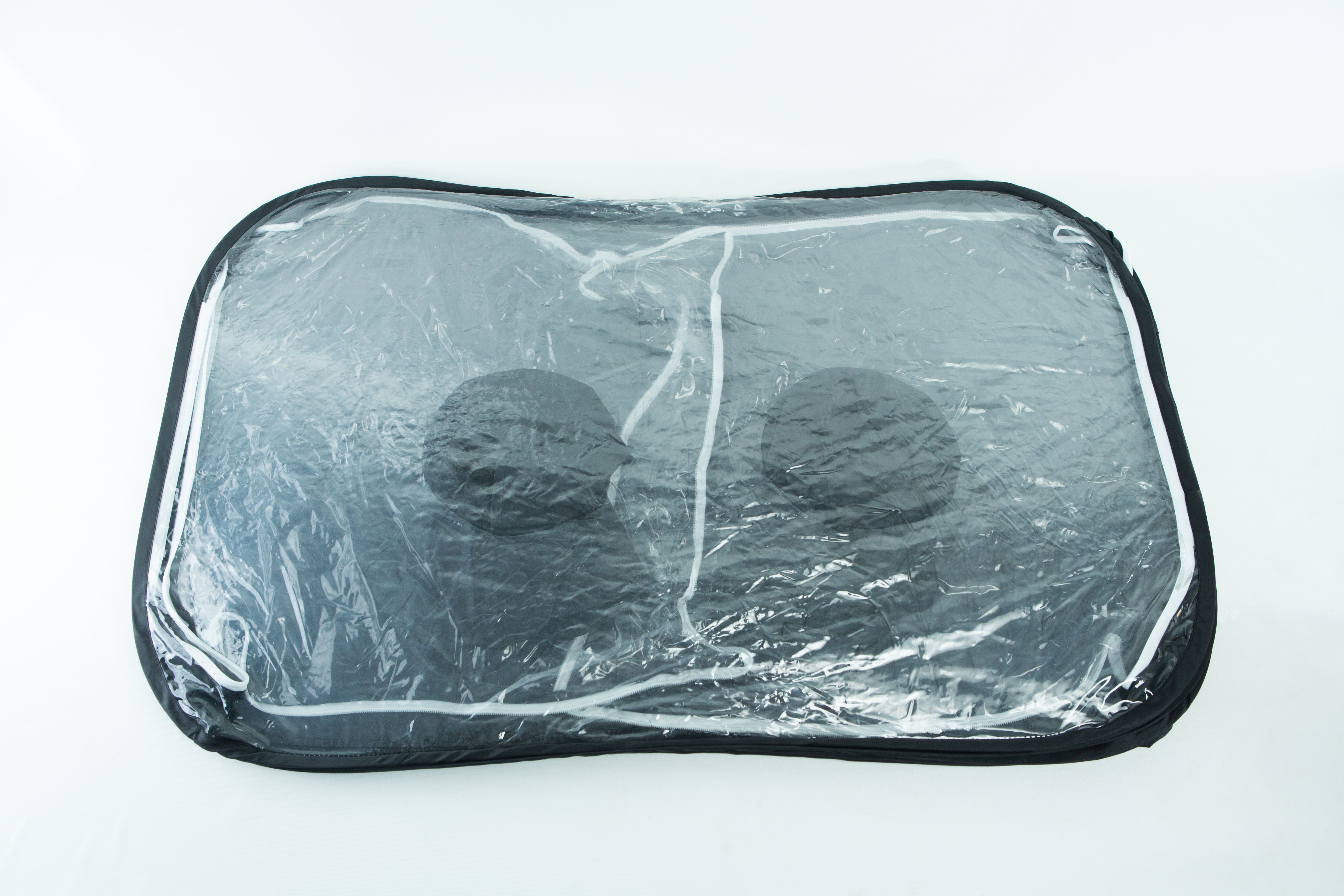 Still Air Box (SAB)| Mushroom | Large | Pop up 3 A transparent storage bag with black trim containing two black round objects.