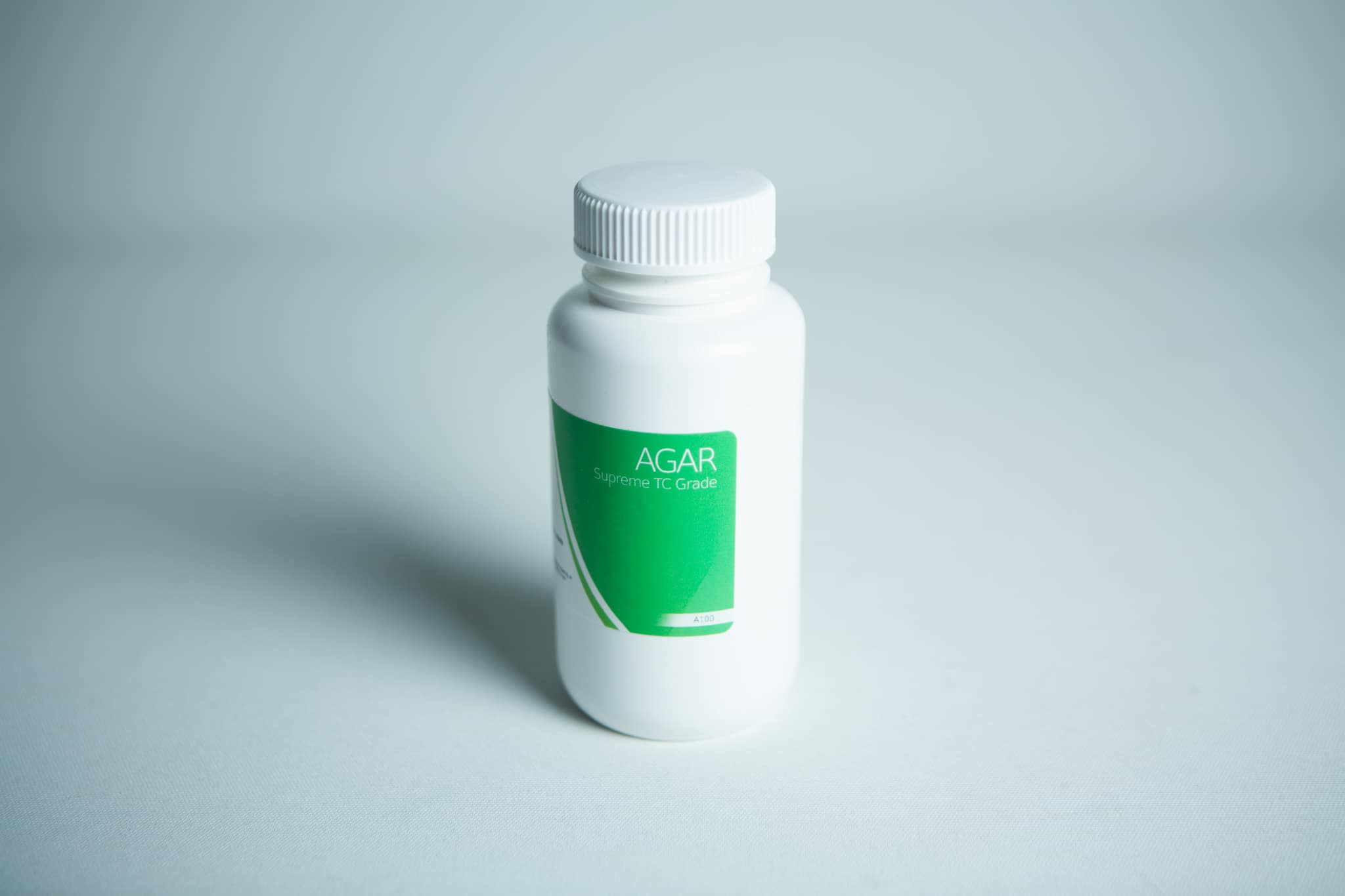 Plant Cell Tissue Culture Starter Kit 9 A white plastic bottle with a green label displaying "Plant Cell Tissue Culture Starter Kit" on a plain white background.