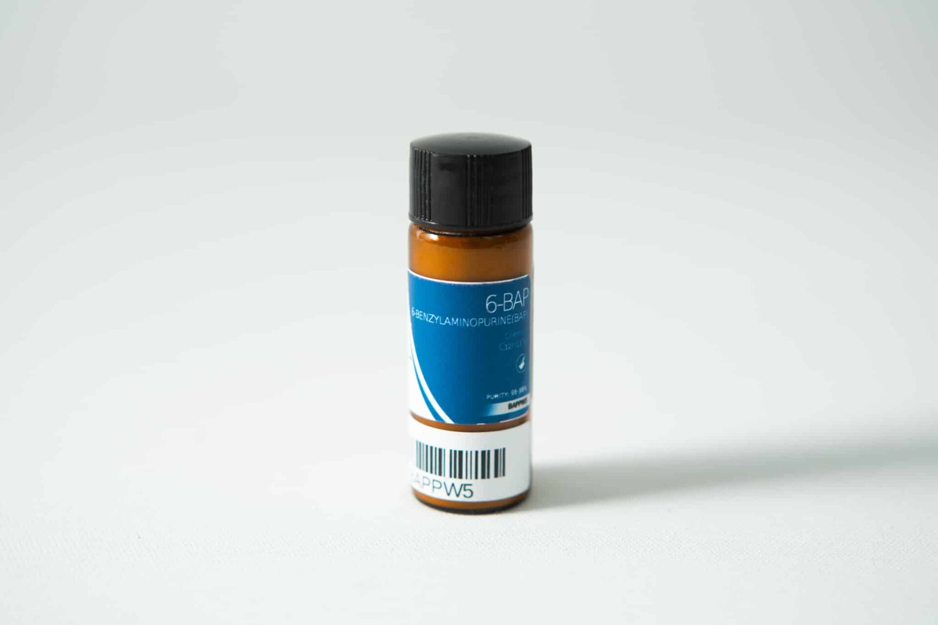 Plant Cell Benzylaminopurine (6-BAP) Powder 1 A small brown bottle labelled "Plant Cell Benzylaminopurine (6-BAP) Powder" with a blue label, black cap, and barcode sits on a white surface.