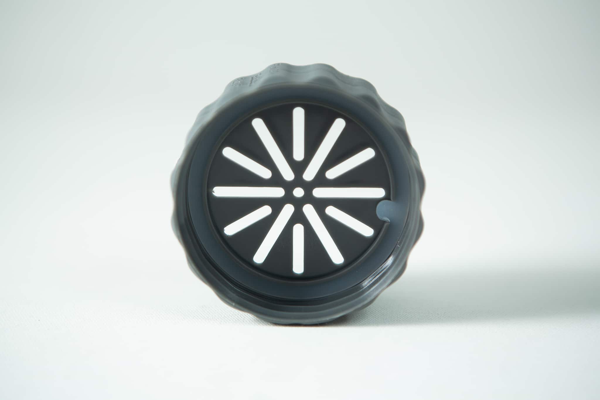 Plant Cell Biocoupler™ collar only (regular mouth) 2 A black round plastic lid with radial slits from the Plant Cell Biocoupler™ Glass Set (16oz, 12oz, 8oz), standing upright on a light surface.