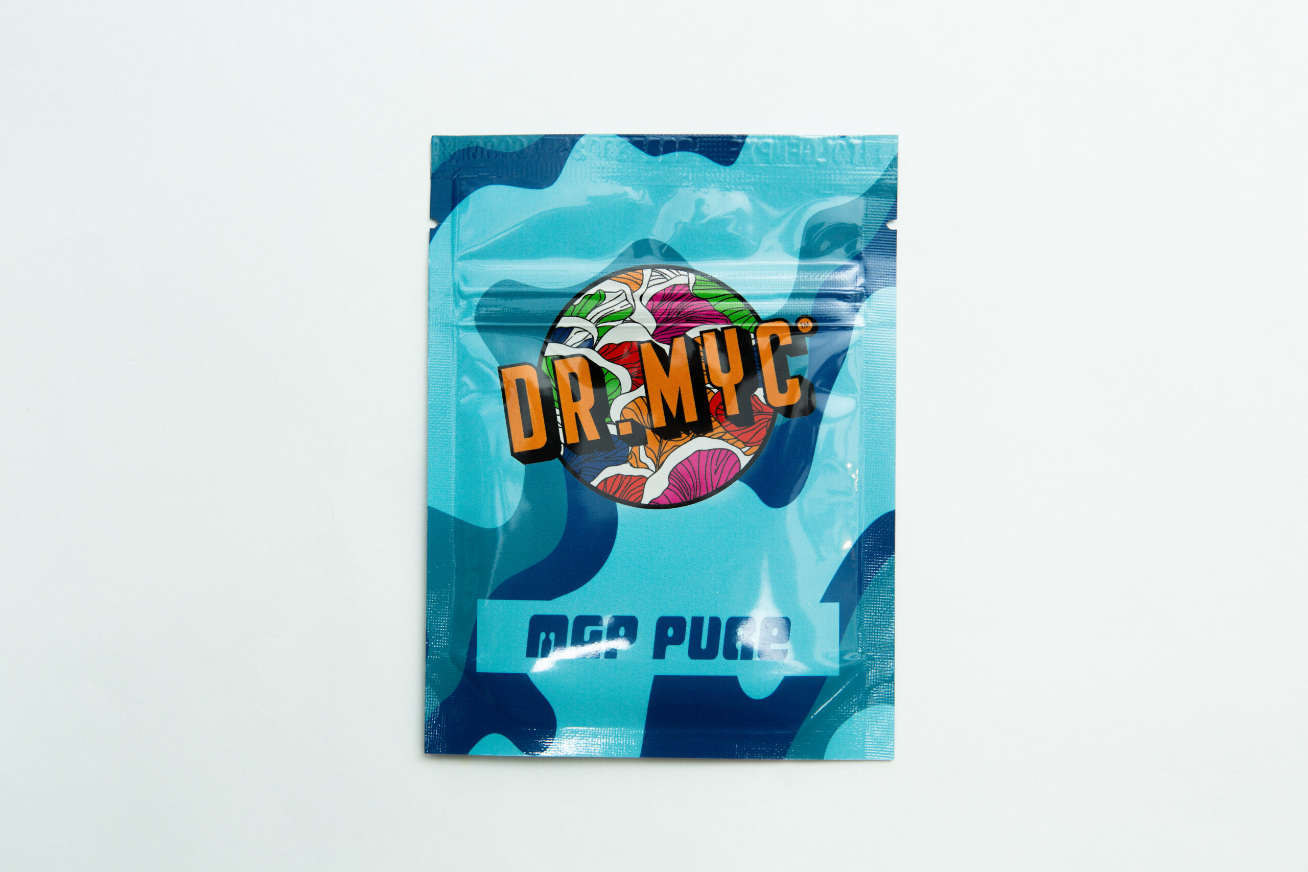 DRMyc MGP Pure - Gourmet/Medicinal Mushroom Growth Promoter 1 A blue packet labelled DRMyc Adaptive Liquid Culture Premix with colourful graphics and partial text "MGA PUGA" on the front.