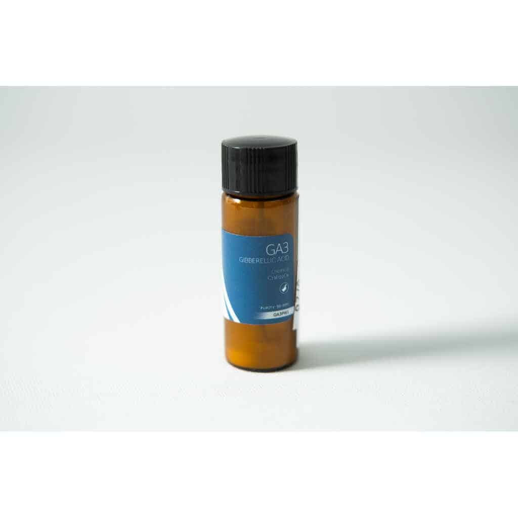 A small brown bottle with a blue label reading "Plant Cell Gibberellic Acid (GA3) Powder" sits on a white surface.