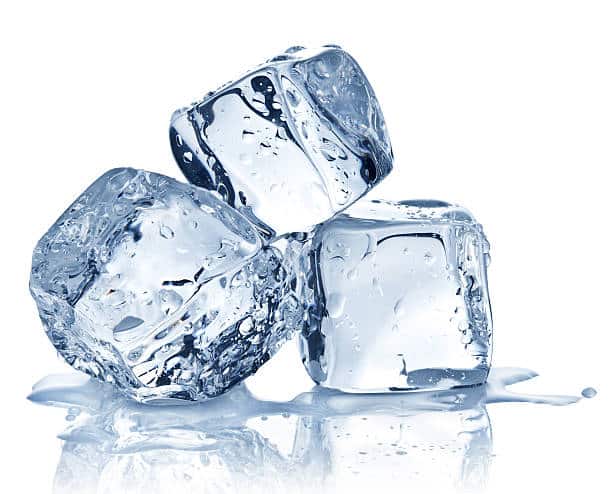 Ice Pack 1 Three ice pack cubes are stacked together, each clear with water droplets and a small puddle forming at the base.