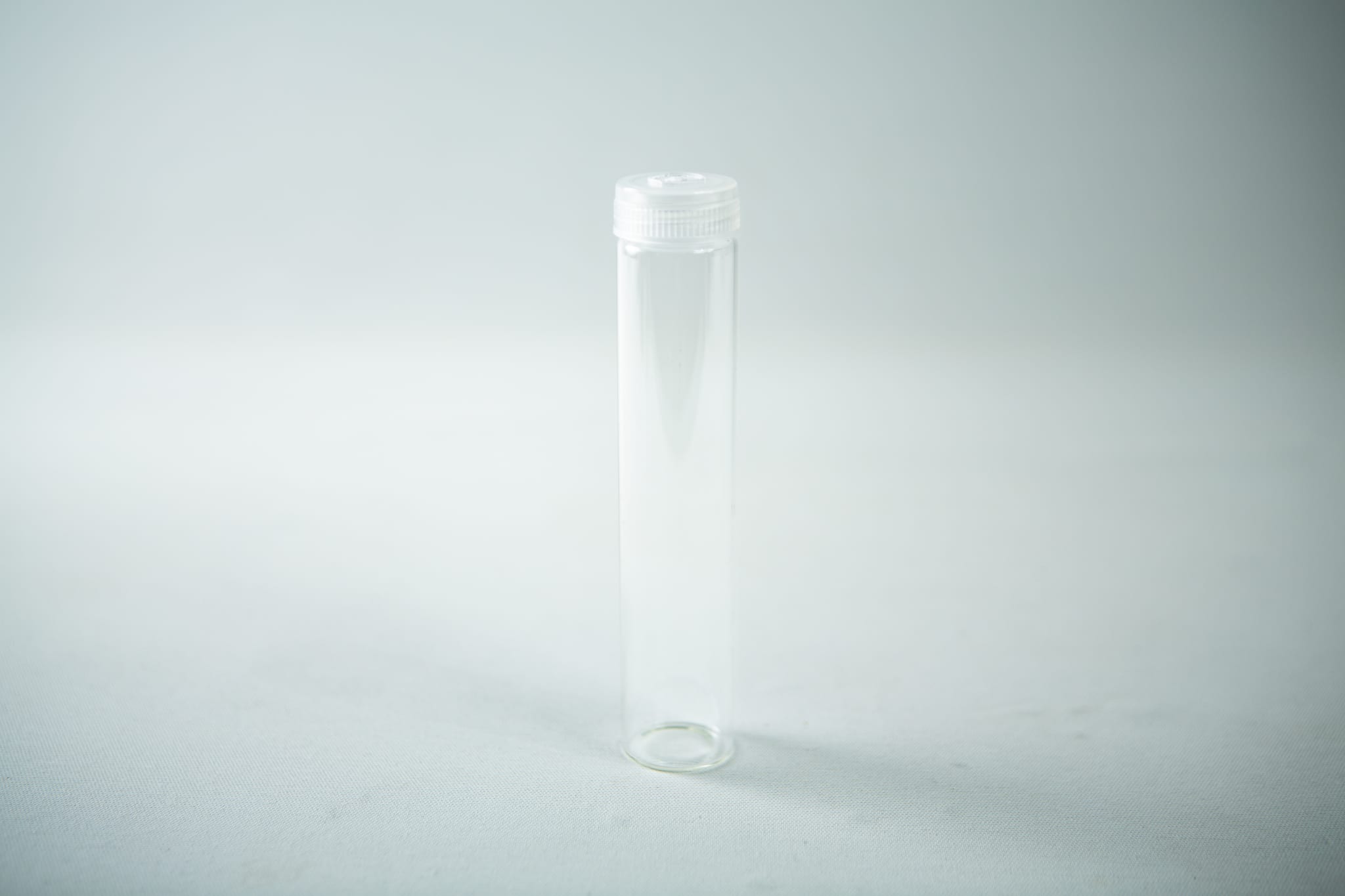 Plant Cell Vented Plant TC Test Tubes with rack 12pc 5 A set of Plant Cell Vented Plant TC Test Tubes with white screw caps, shown upright on a light surface in their rack; comes as a 12-piece set.