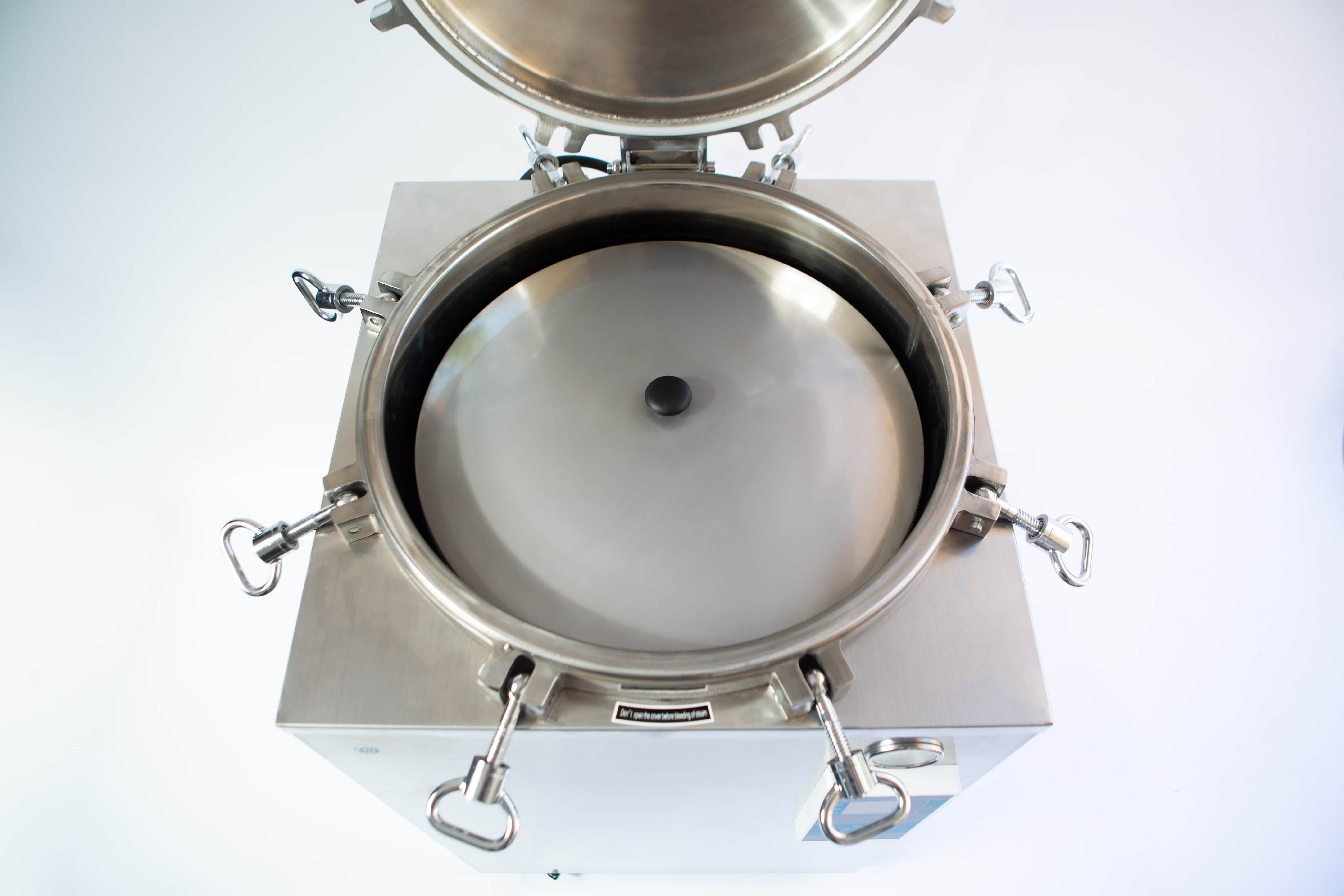 Vertical Autoclave 150 Liters (Automatic) | Commercial use | 6KW 11 Open stainless steel autoclave with lid lifted, showing the circular inner chamber and locking clips.