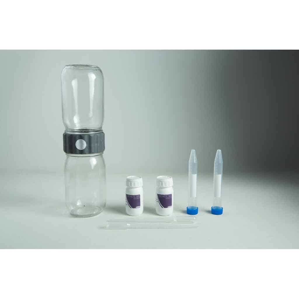 A water testing kit with bottles, vials, dropper, and containers on a grey background—ideal for use with your Plantcell Synthetic Seed Starter Kit to ensure optimal hydration and healthy plant growth.