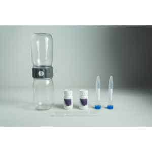 A water testing kit with bottles, vials, dropper, and containers on a grey background—ideal for use with your Plantcell Synthetic Seed Starter Kit to ensure optimal hydration and healthy plant growth.